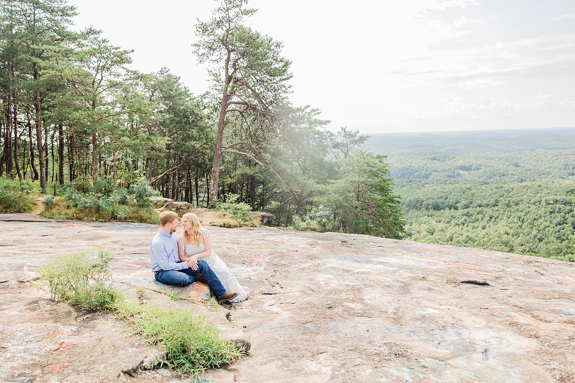 couple sits on Bald Rock in Greenville SC