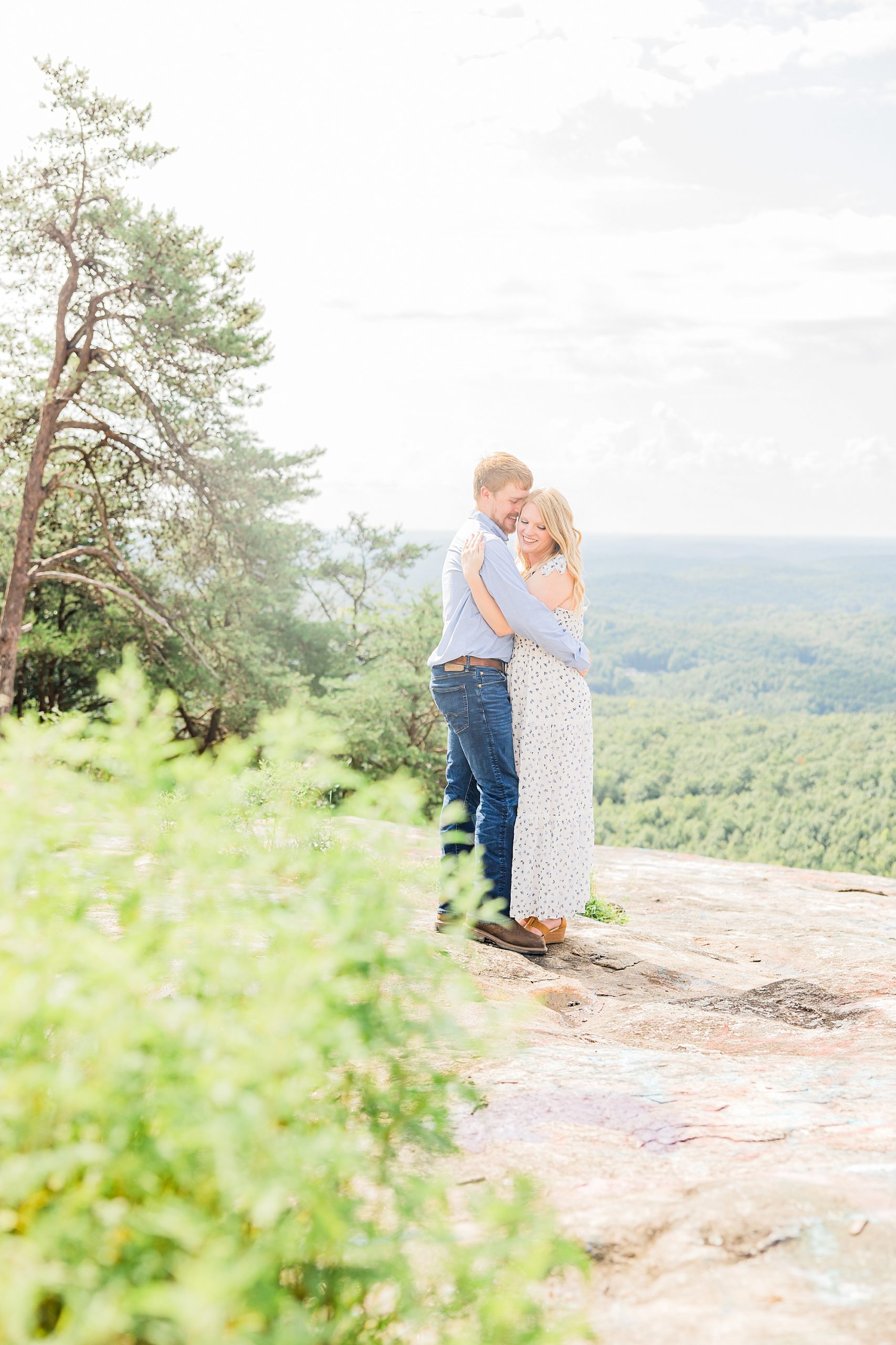 bride and groom hold each other during Bald Rock engagement session
