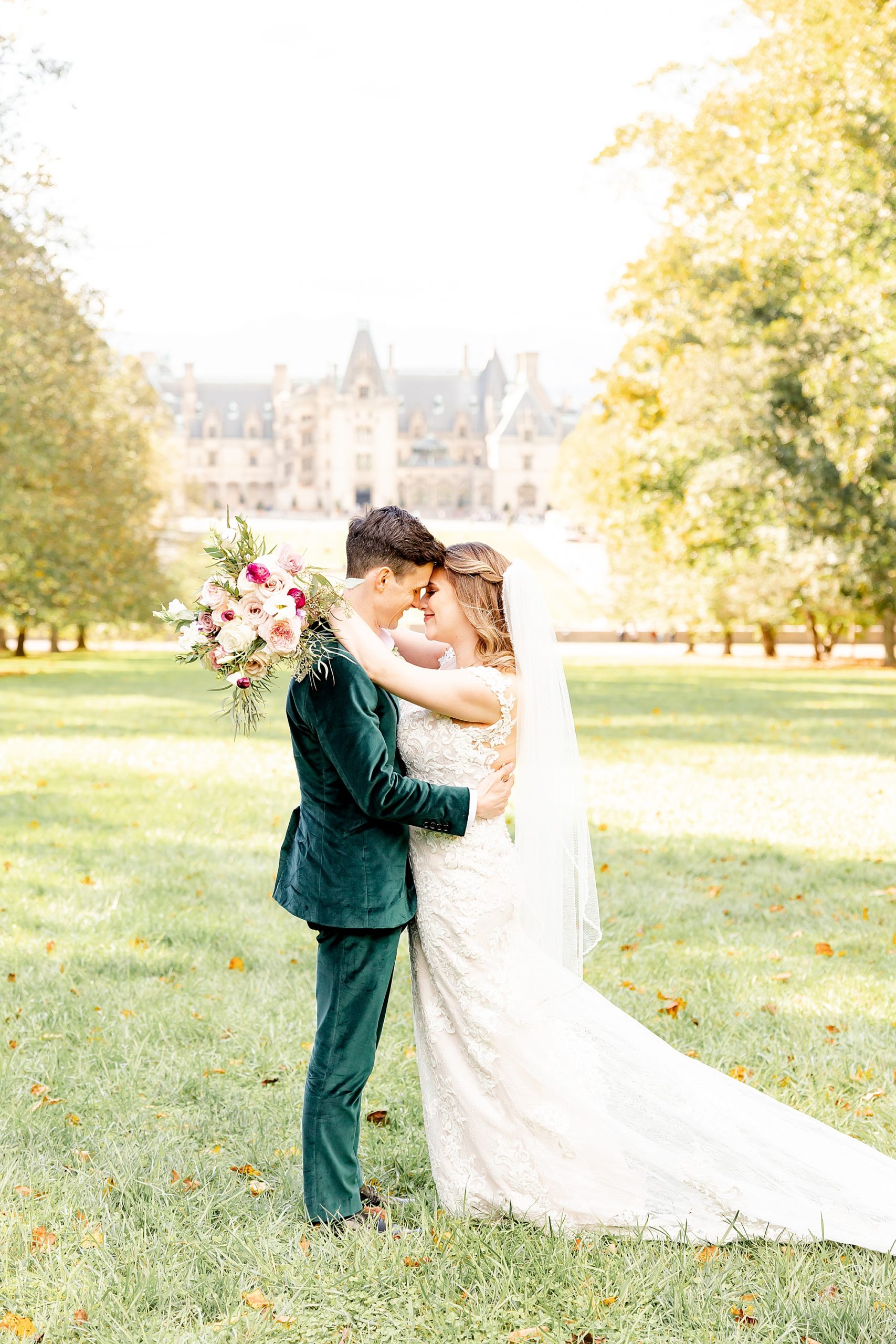 newlyweds stand with noses touching during fall Biltmore Estate wedding