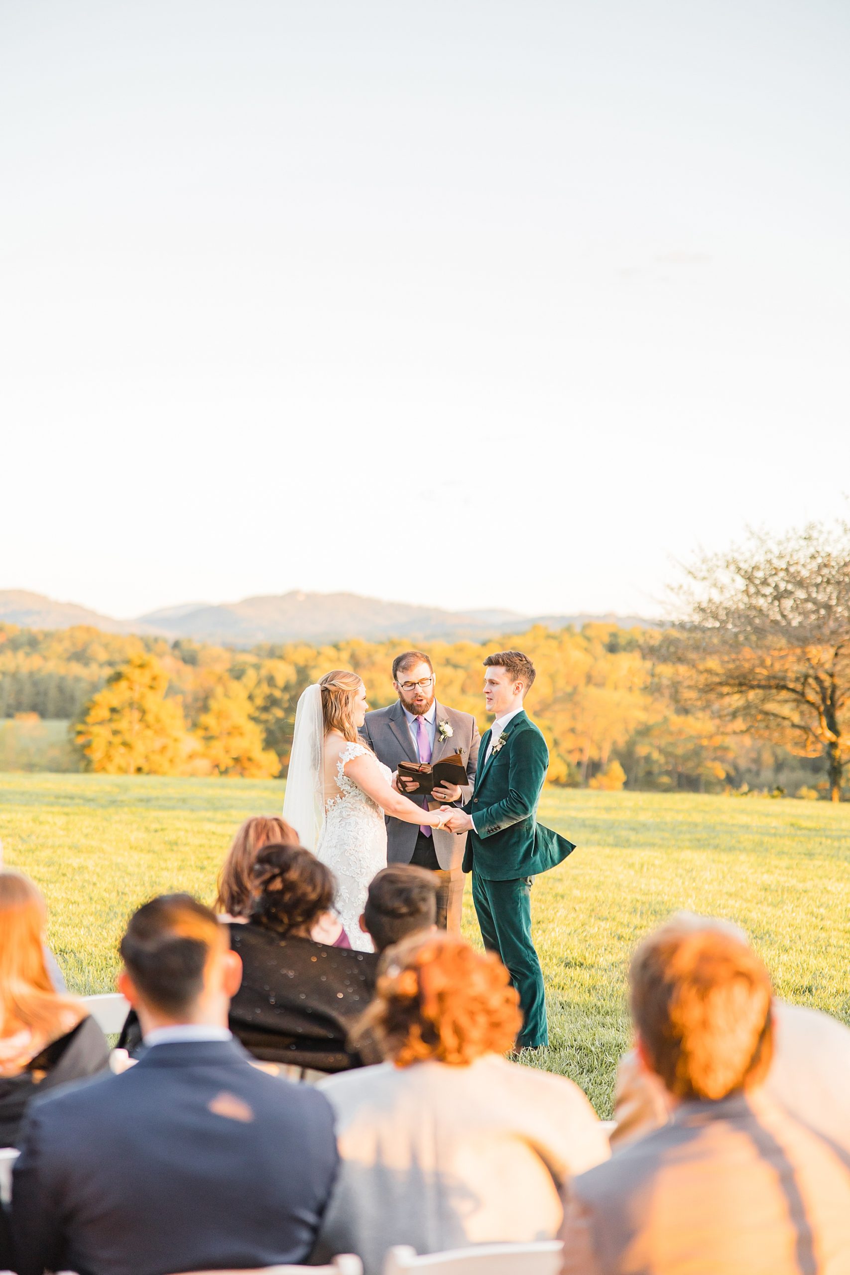 newlyweds read vows together during Asheville NC outdoor wedding ceremony