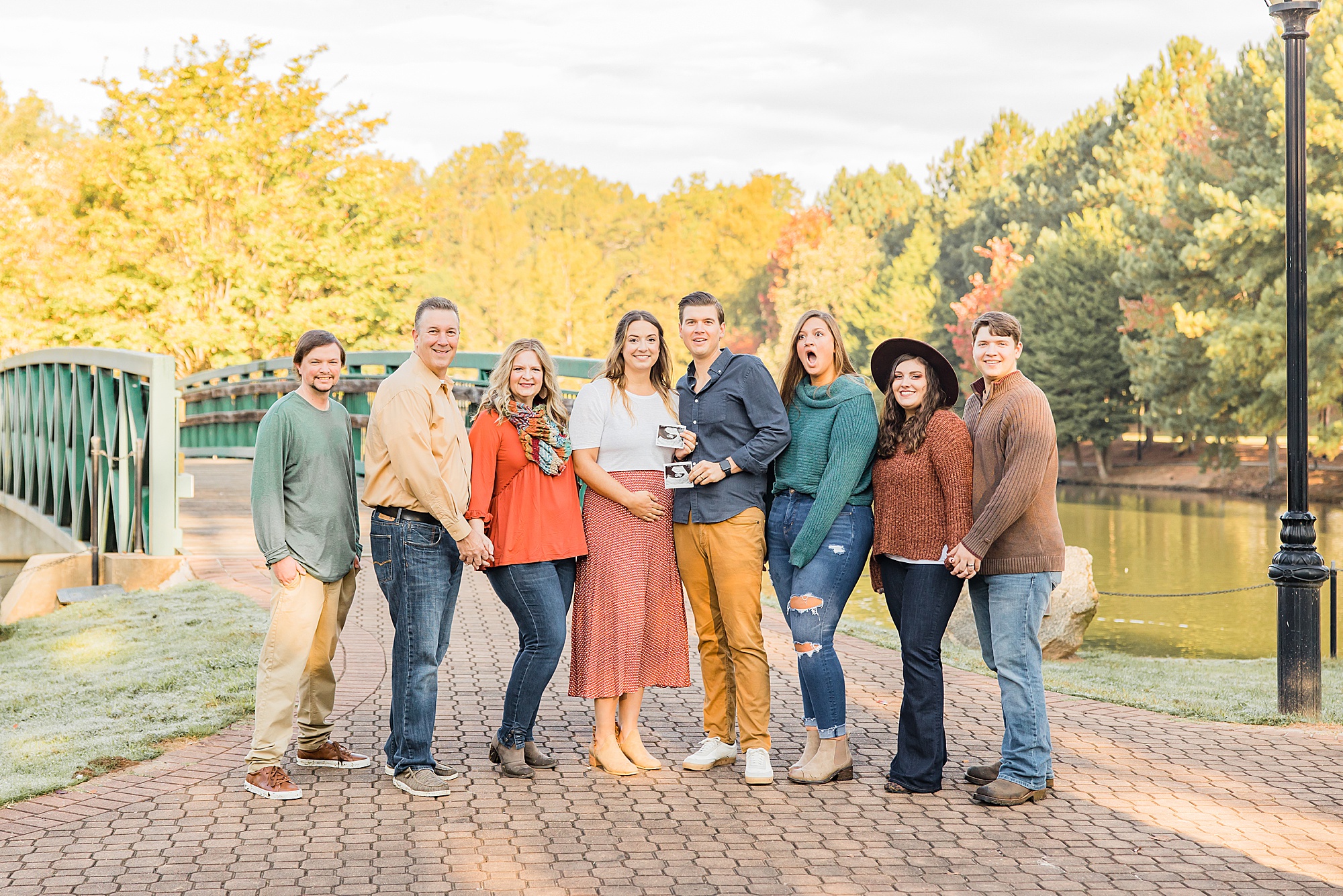 family reacts to pregnancy announcement during Cleveland Park family portraits