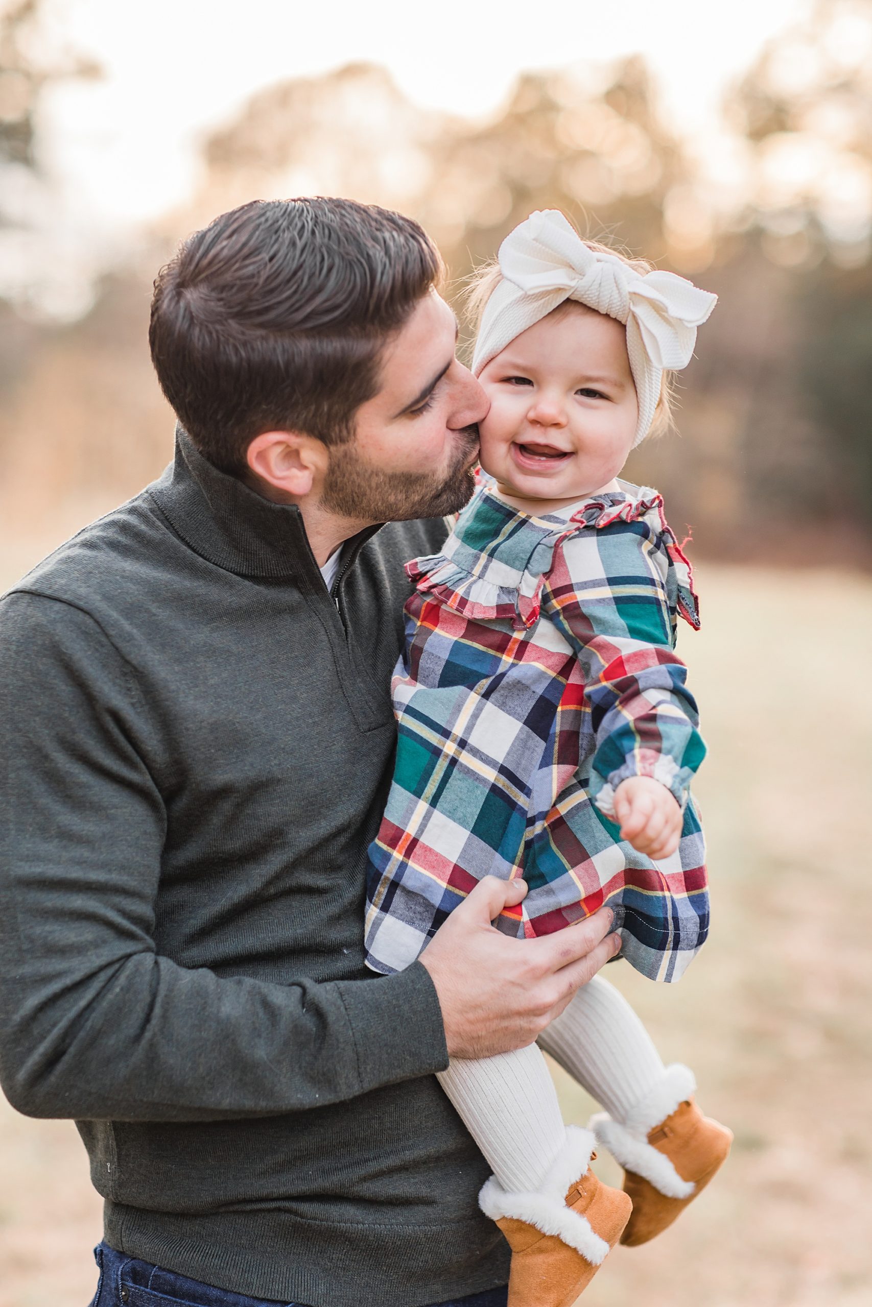 dad kisses his daughter during SC family photos
