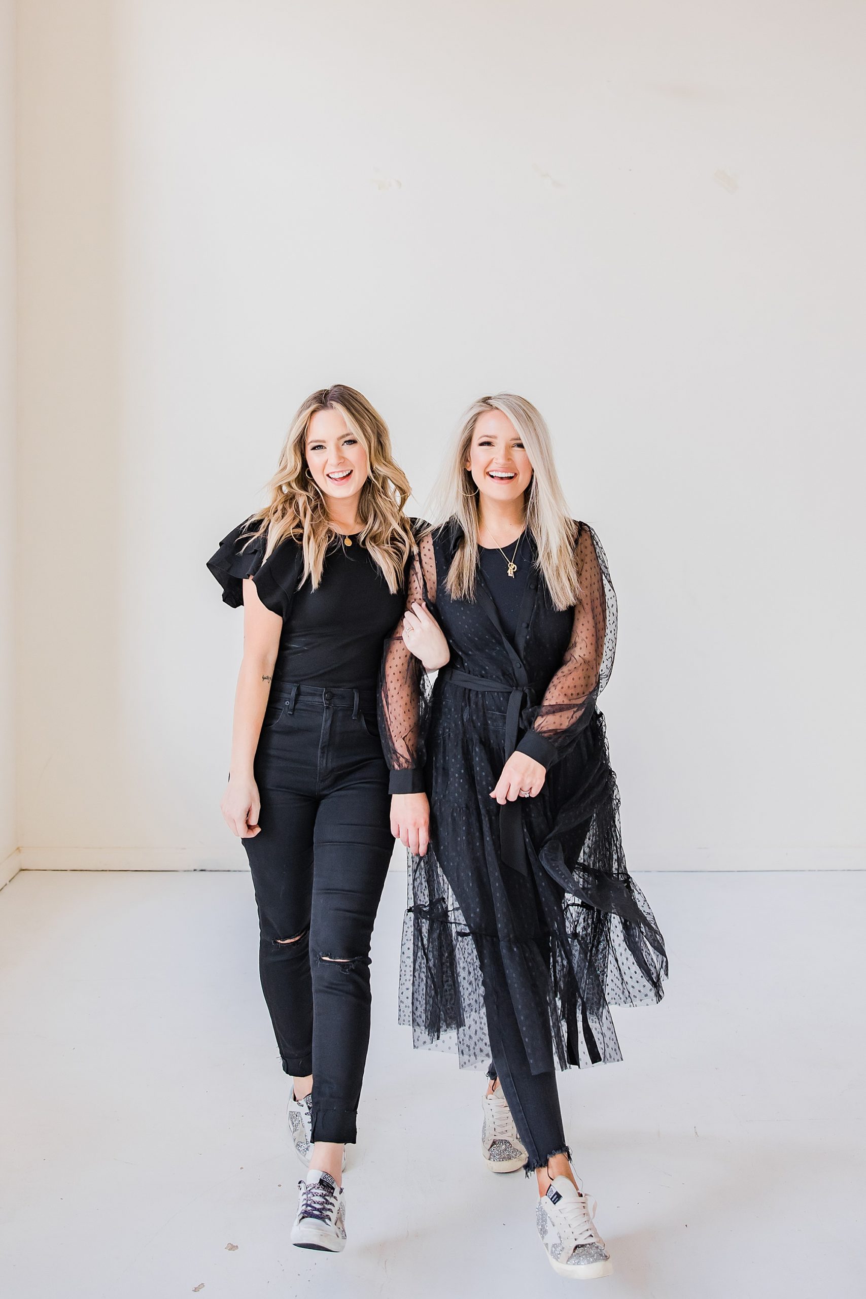 stylists walk together in studio during branding photos 