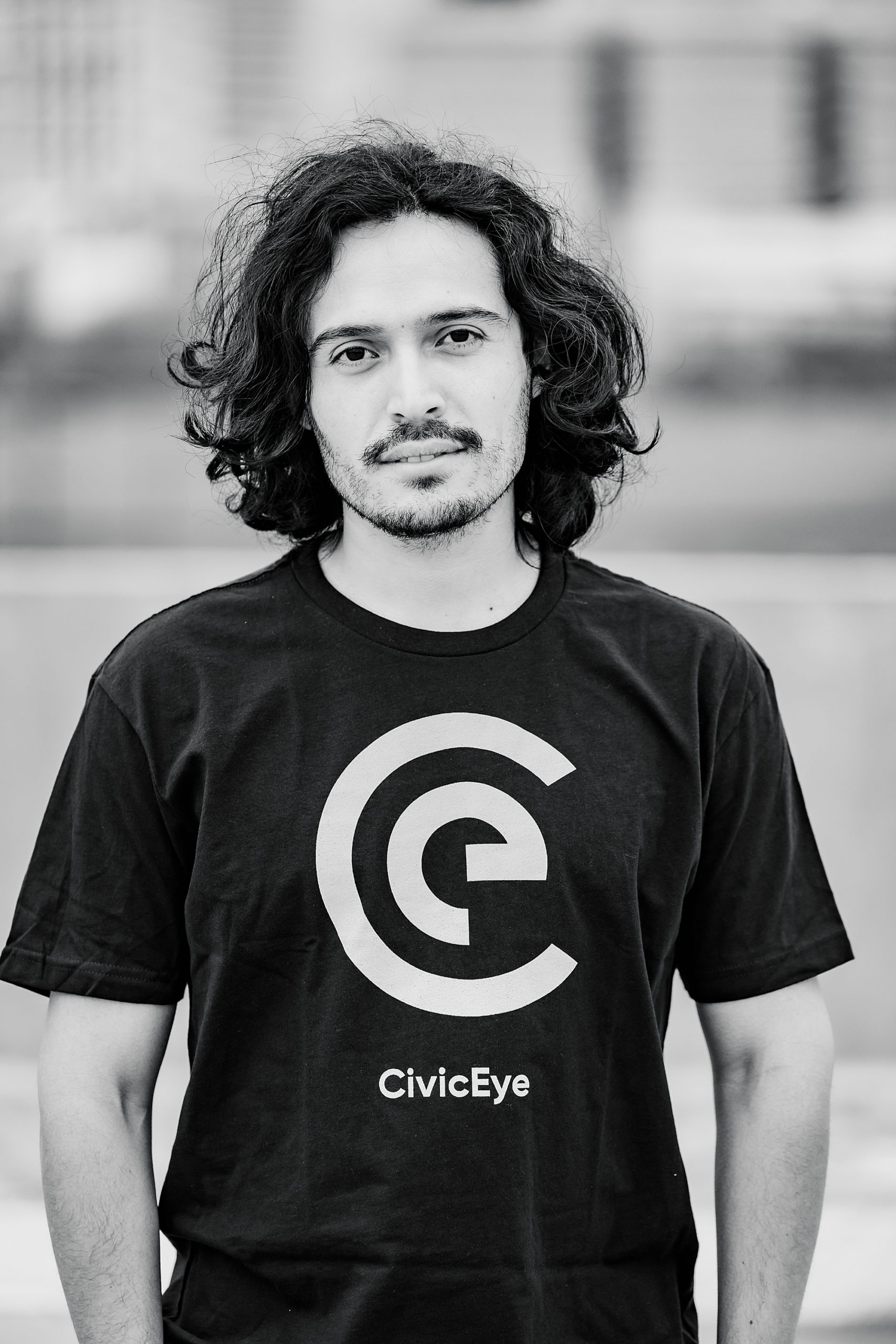 man poses with CivicEye t-shirt on during Charlotte headshots