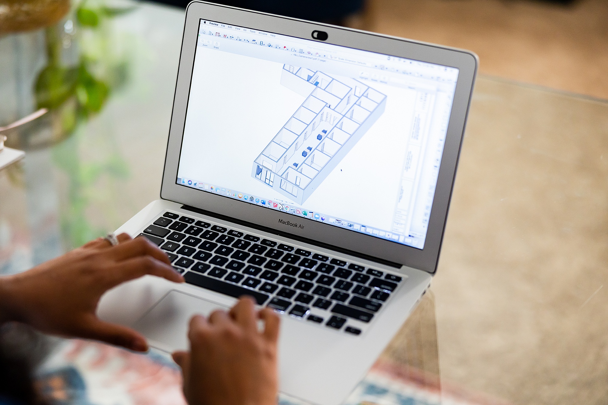designer works on laptop during branding session