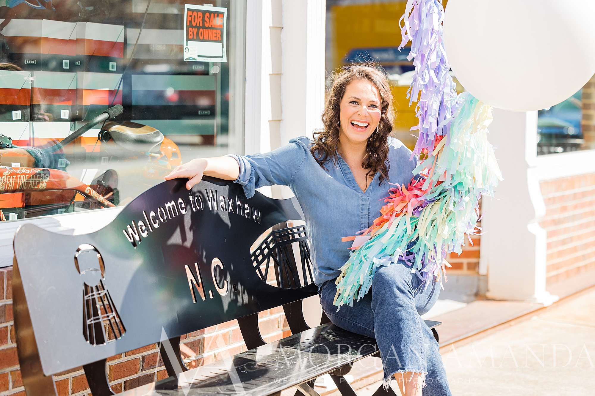 branding portraits for balloon artist holding big white balloon in Downtown Waxhaw