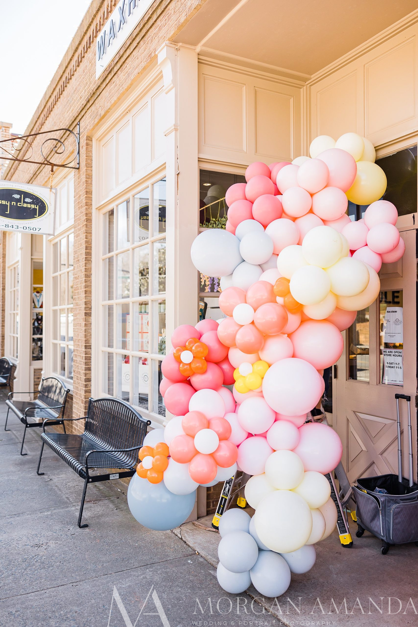 balloon arch created by Twist n Shout outside Downtown Waxhaw candle shop