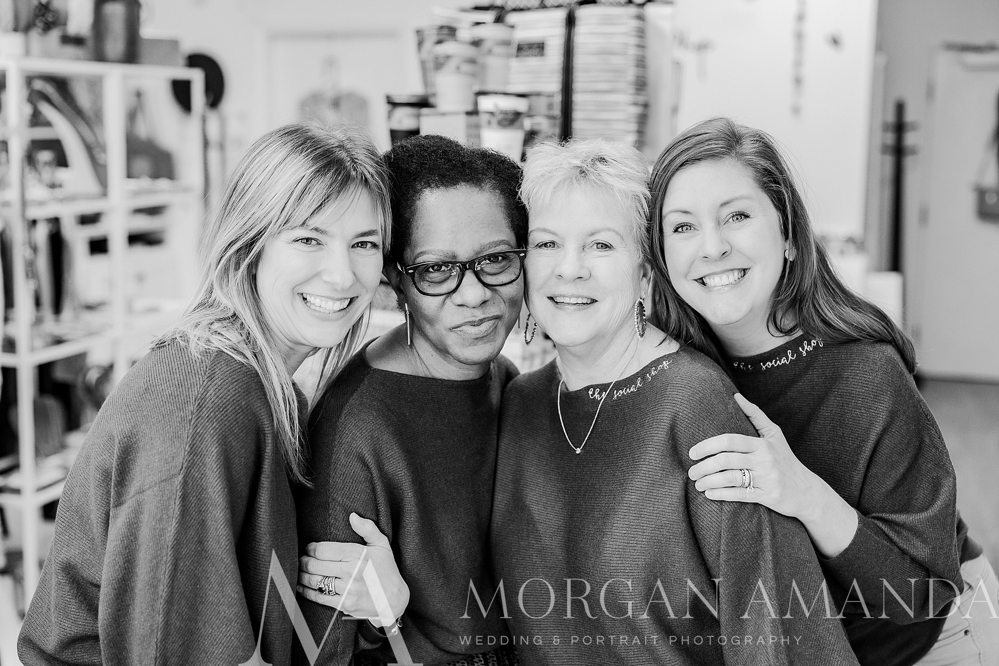 four women hug together during Galentine's Day event at The Social Shop