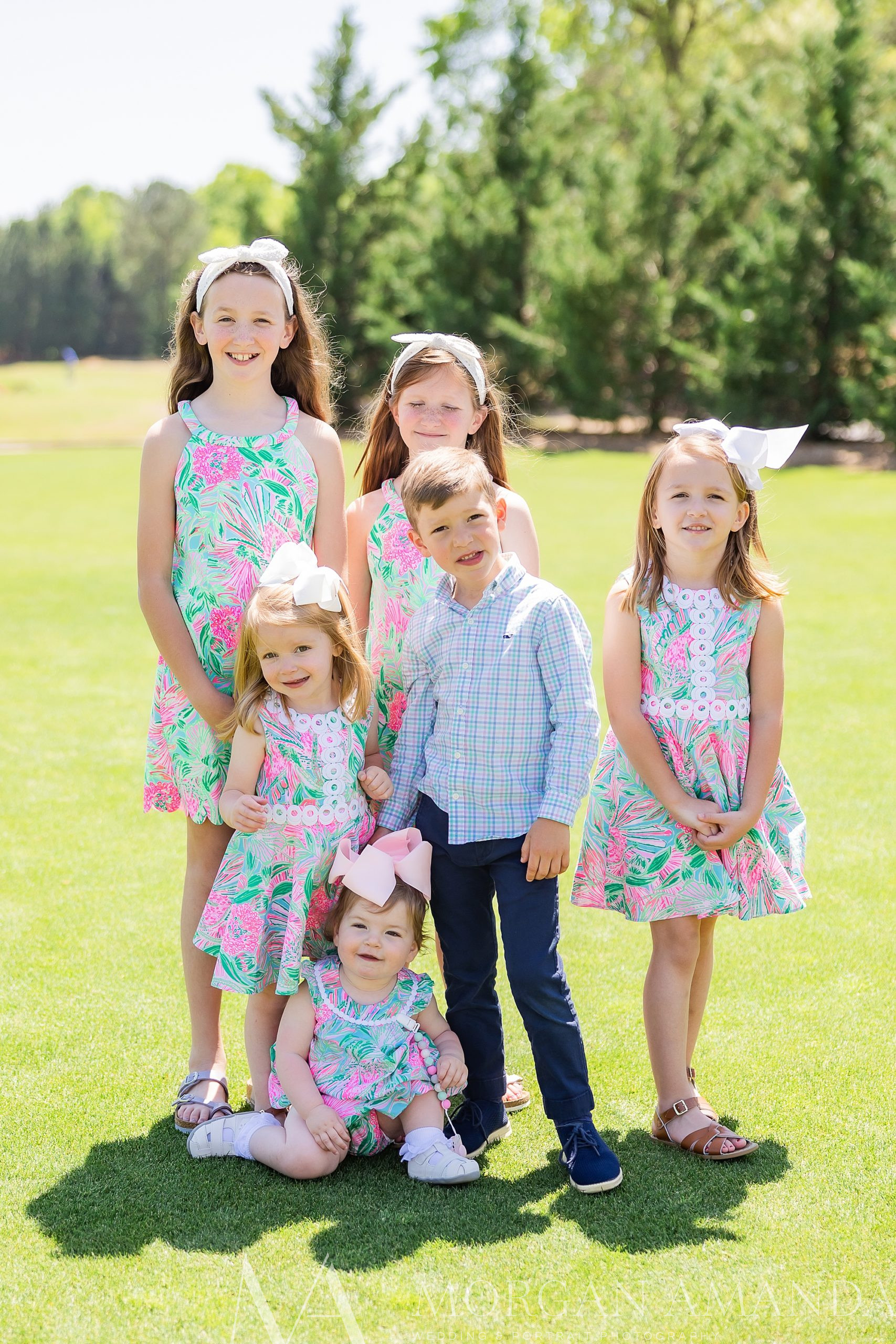 six cousins stand together on lawn at Providence Country Club