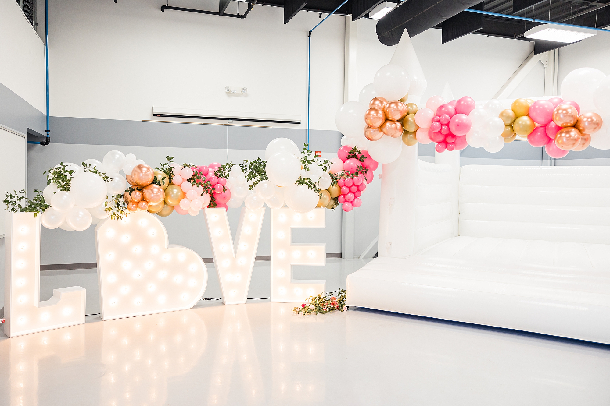 bounce castle and block letters for springtime wedding styled shoot