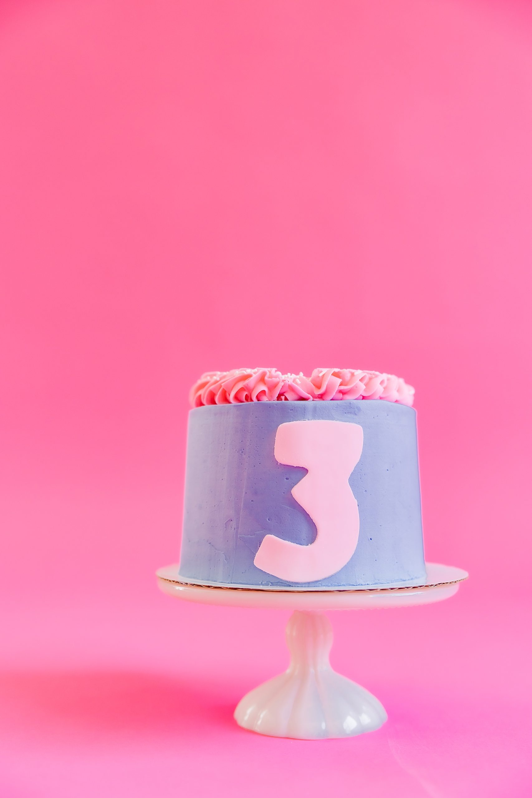 pink and purple cake for playful branding portraits cake smash