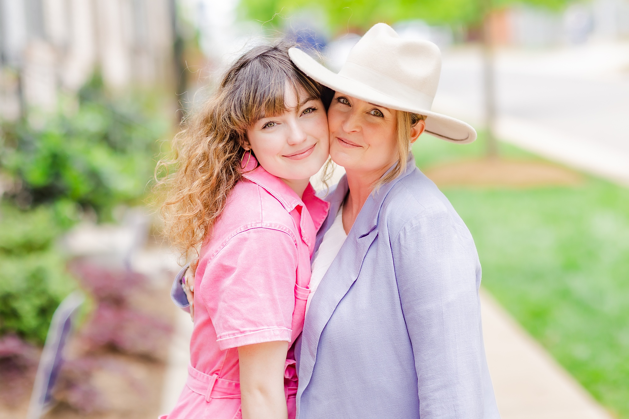 daughter hugs mom during branding photos for clothing business