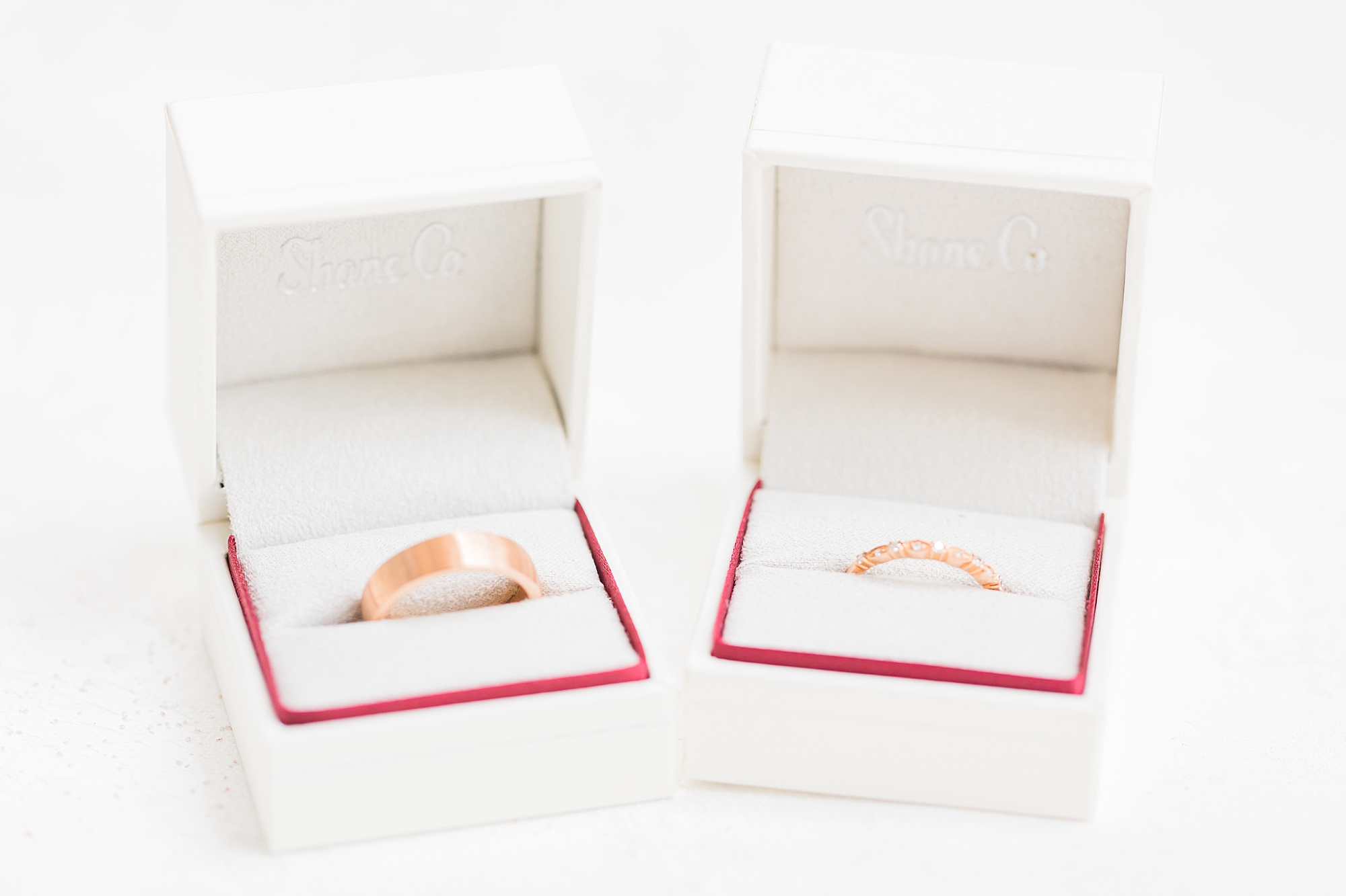 wedding bands in white boxes