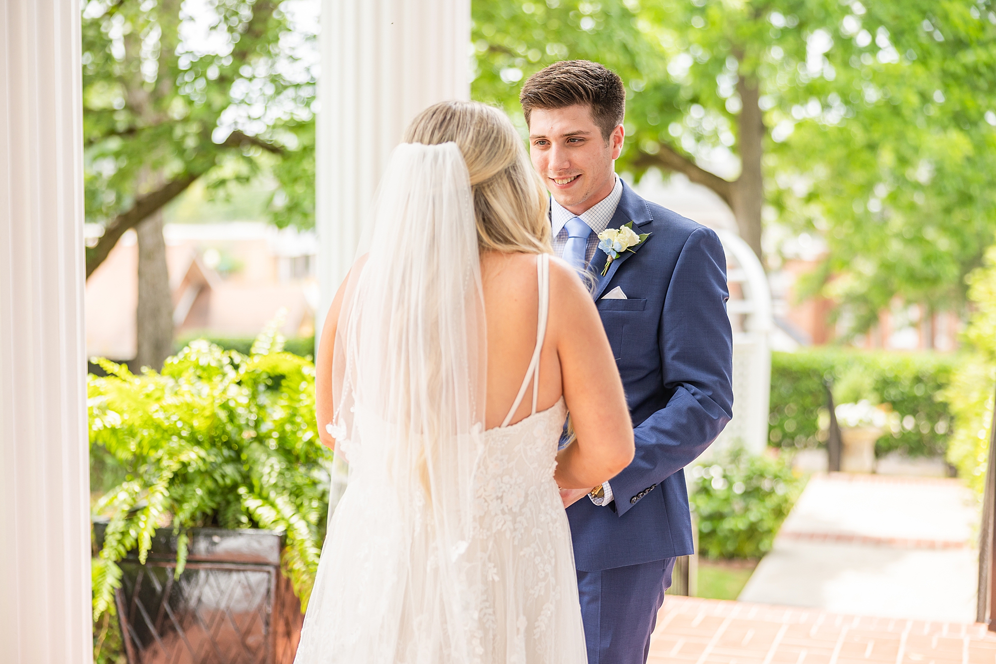 groom sees bride for the first time at Victoria Belle Mansion
