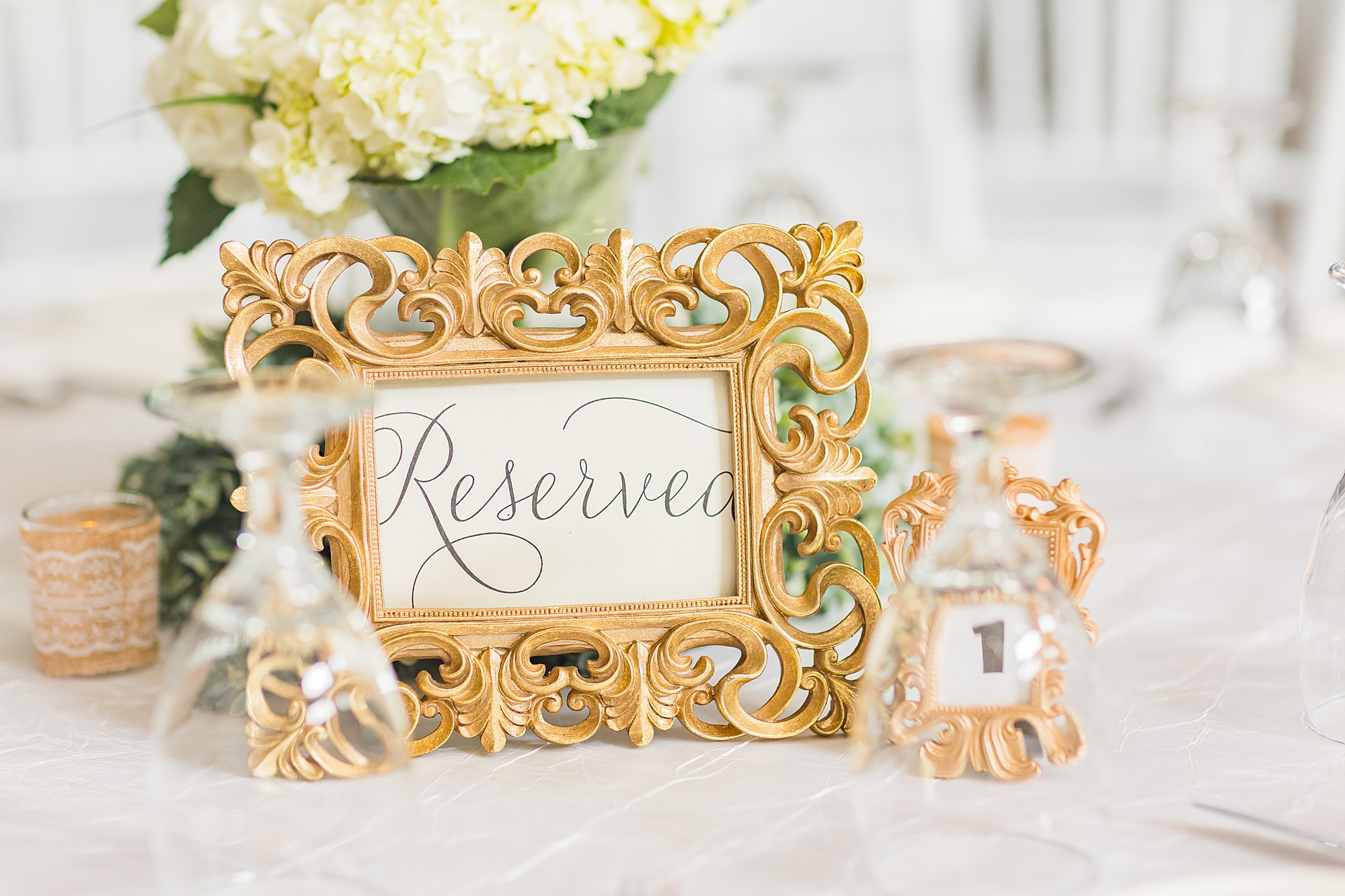 gold "reserved" seating sign for GA wedding reception