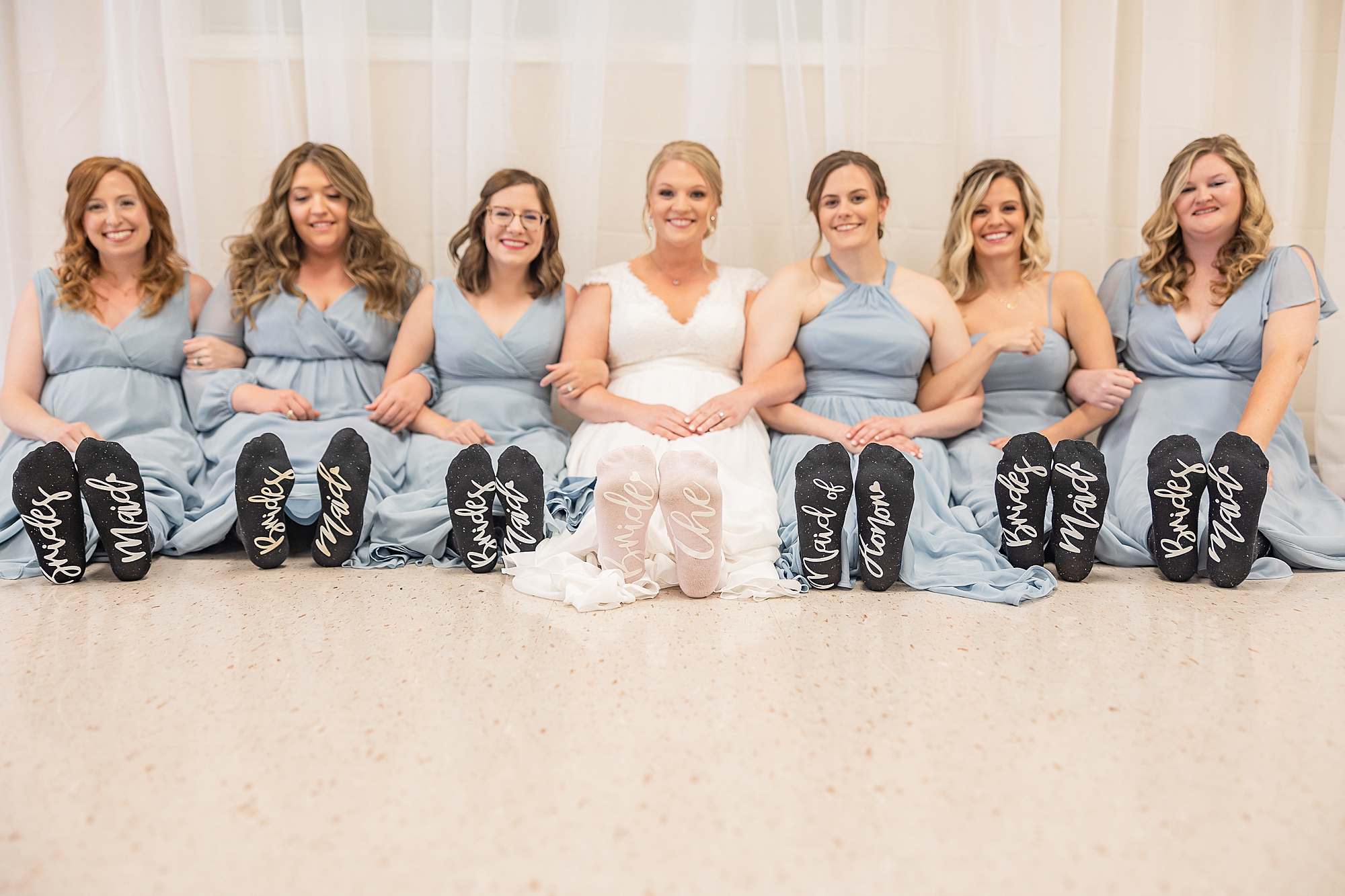 bride and bridesmaids show off shoes for Blairsville GA wedding