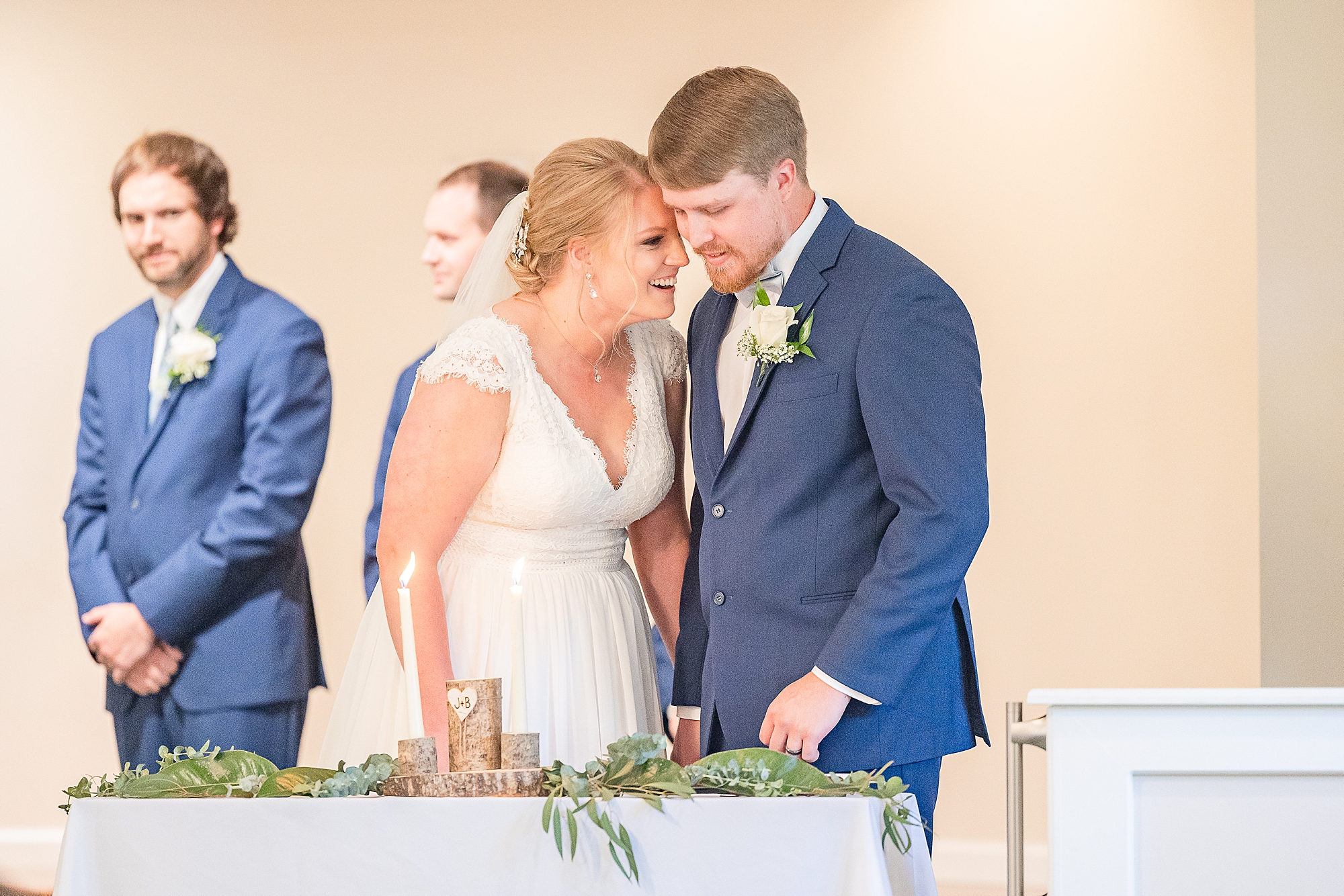 newlyweds laugh during Blairsville GA wedding ceremony in church