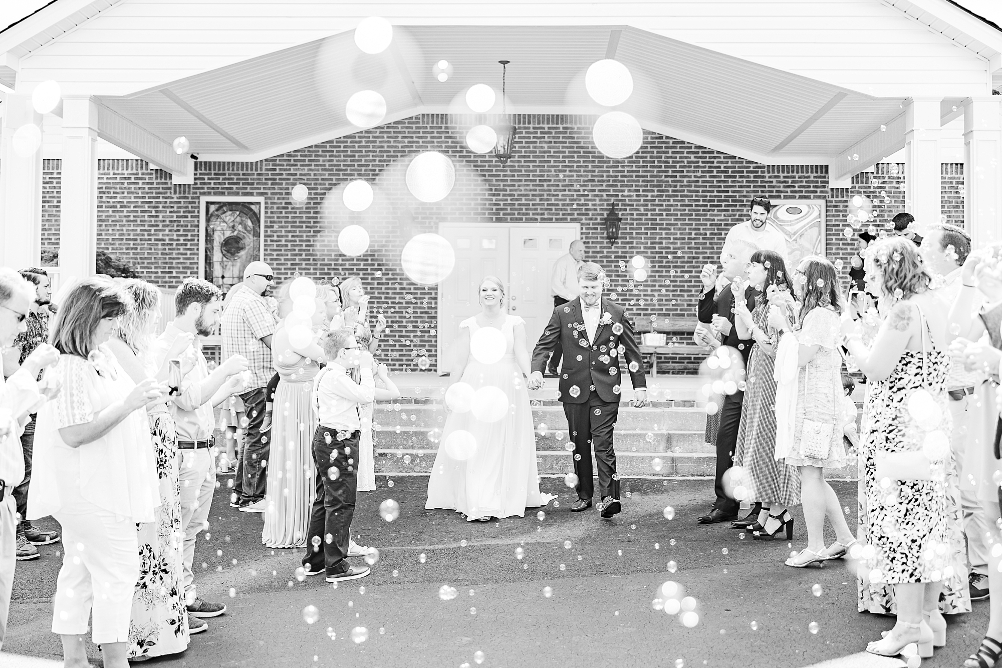 newlyweds leave church with bubble exit