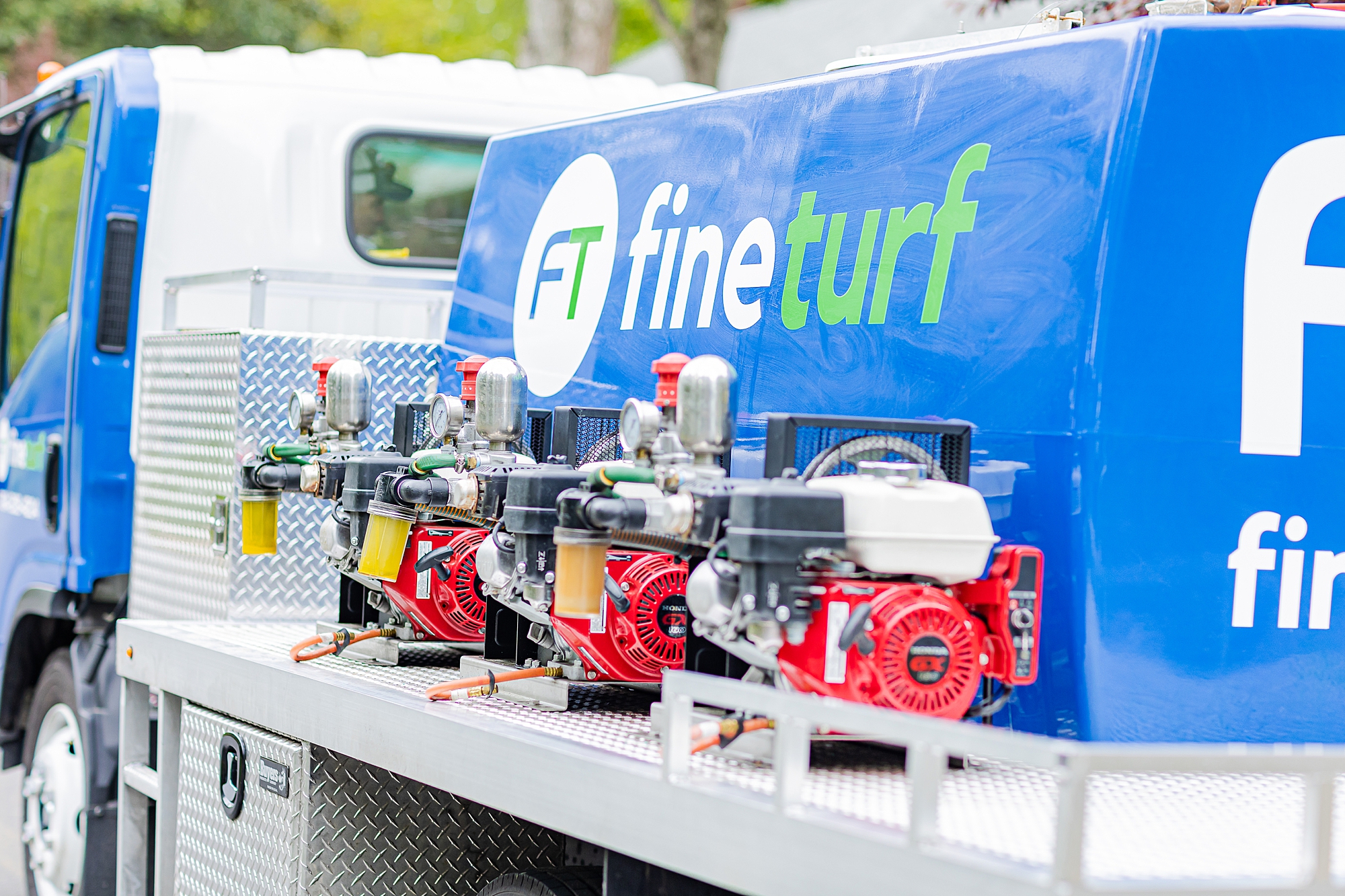 company truck sits on road during Charlotte branding session with Fine Turf