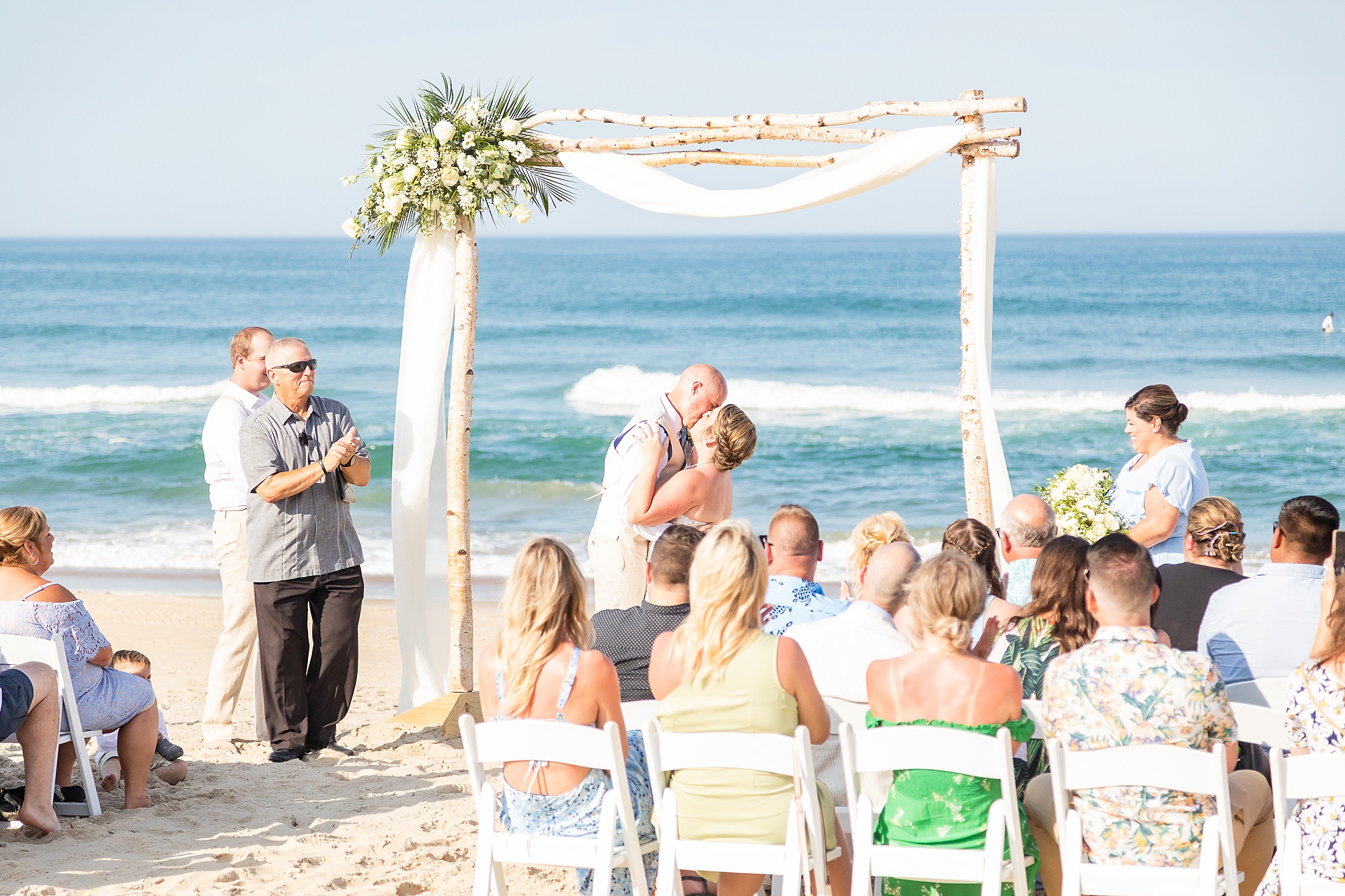 groom dips bride during wedding ceremony in Outer Banks