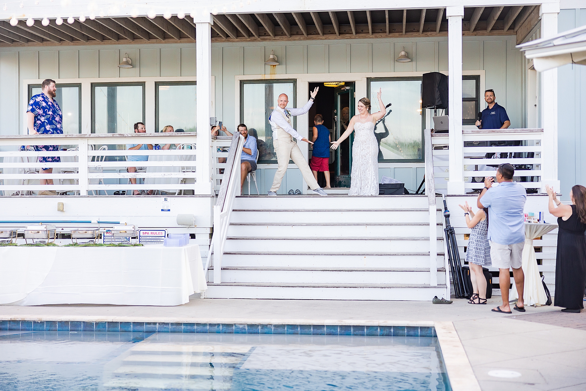 bride and groom enter wedding reception at OBX beach house