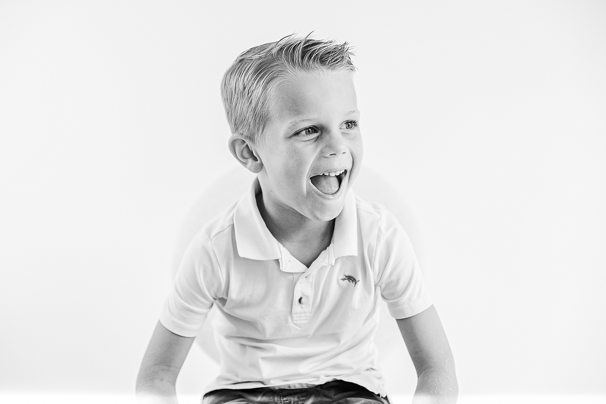 boy laughs in home studio during portraits 