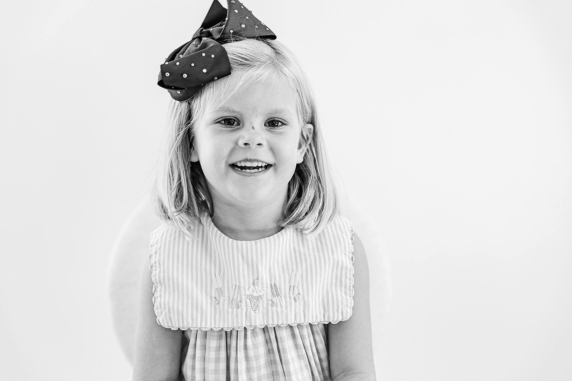 girl smiles in studio during Charlotte Personality Portraits