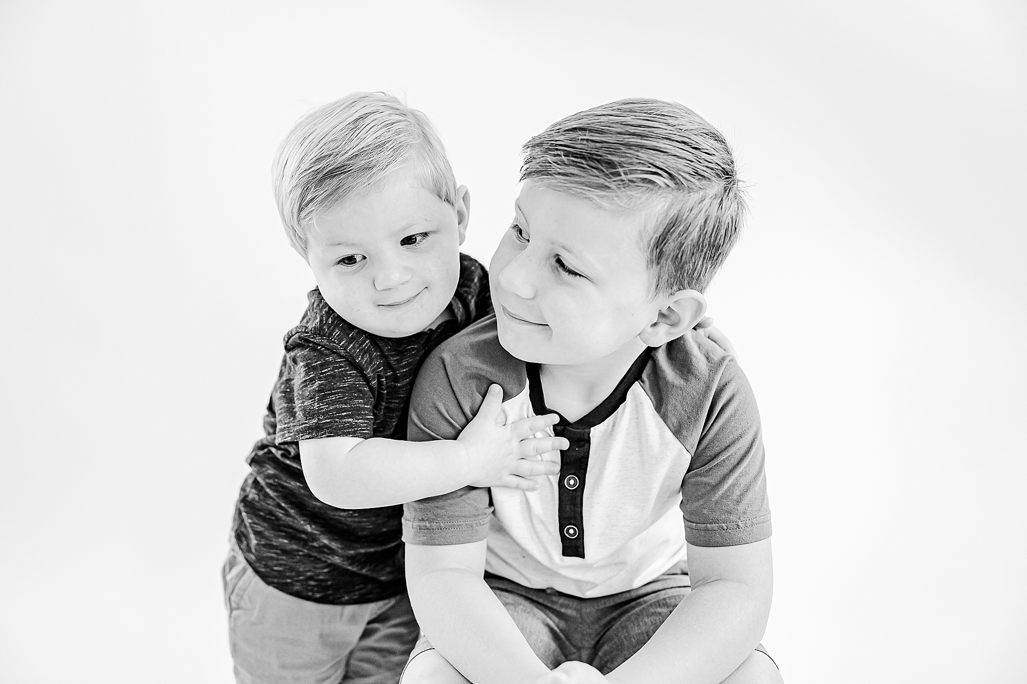 boys hug during studio personality portraits
