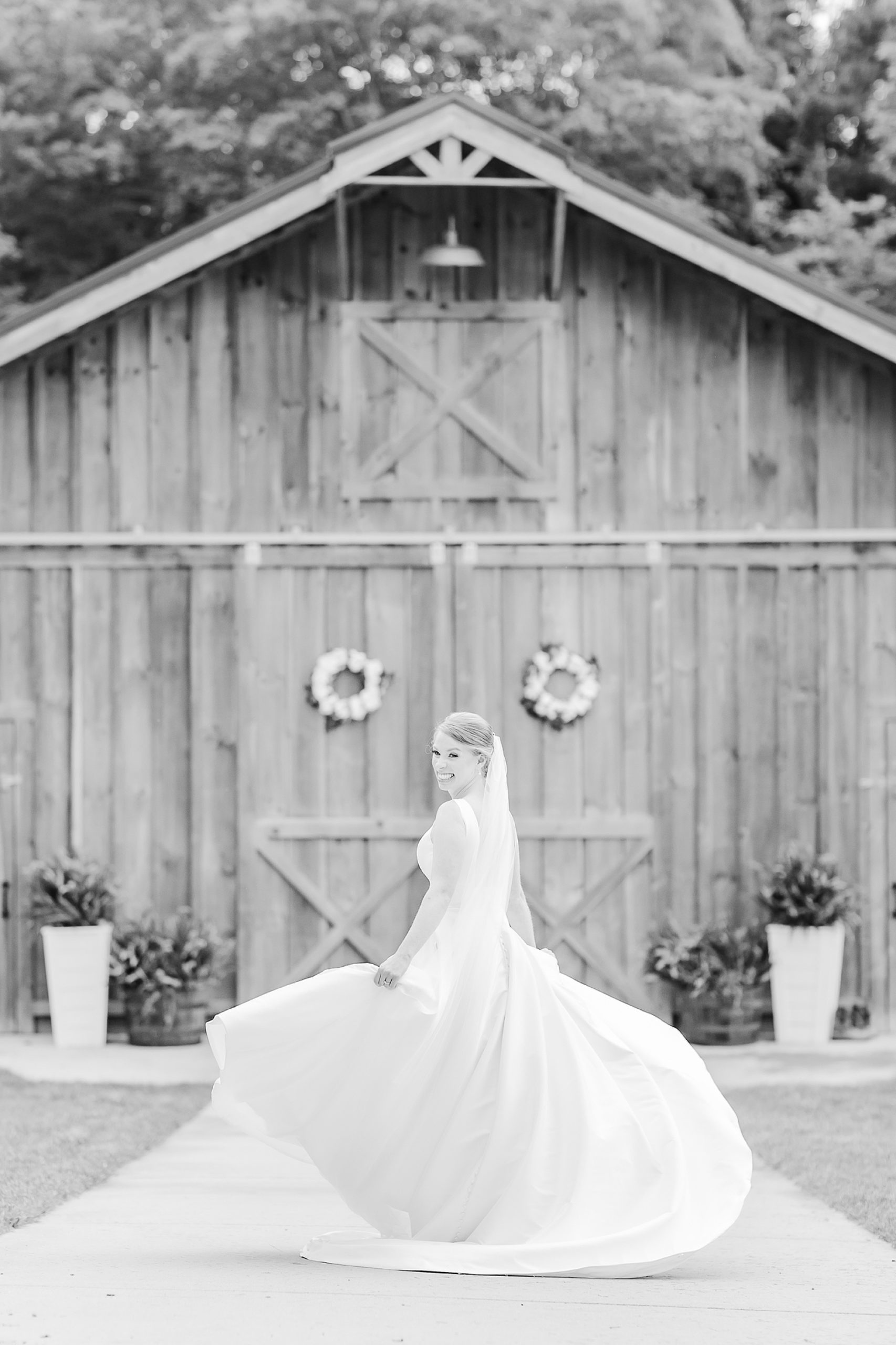 bride twirls wedding dress during bridal portraits 