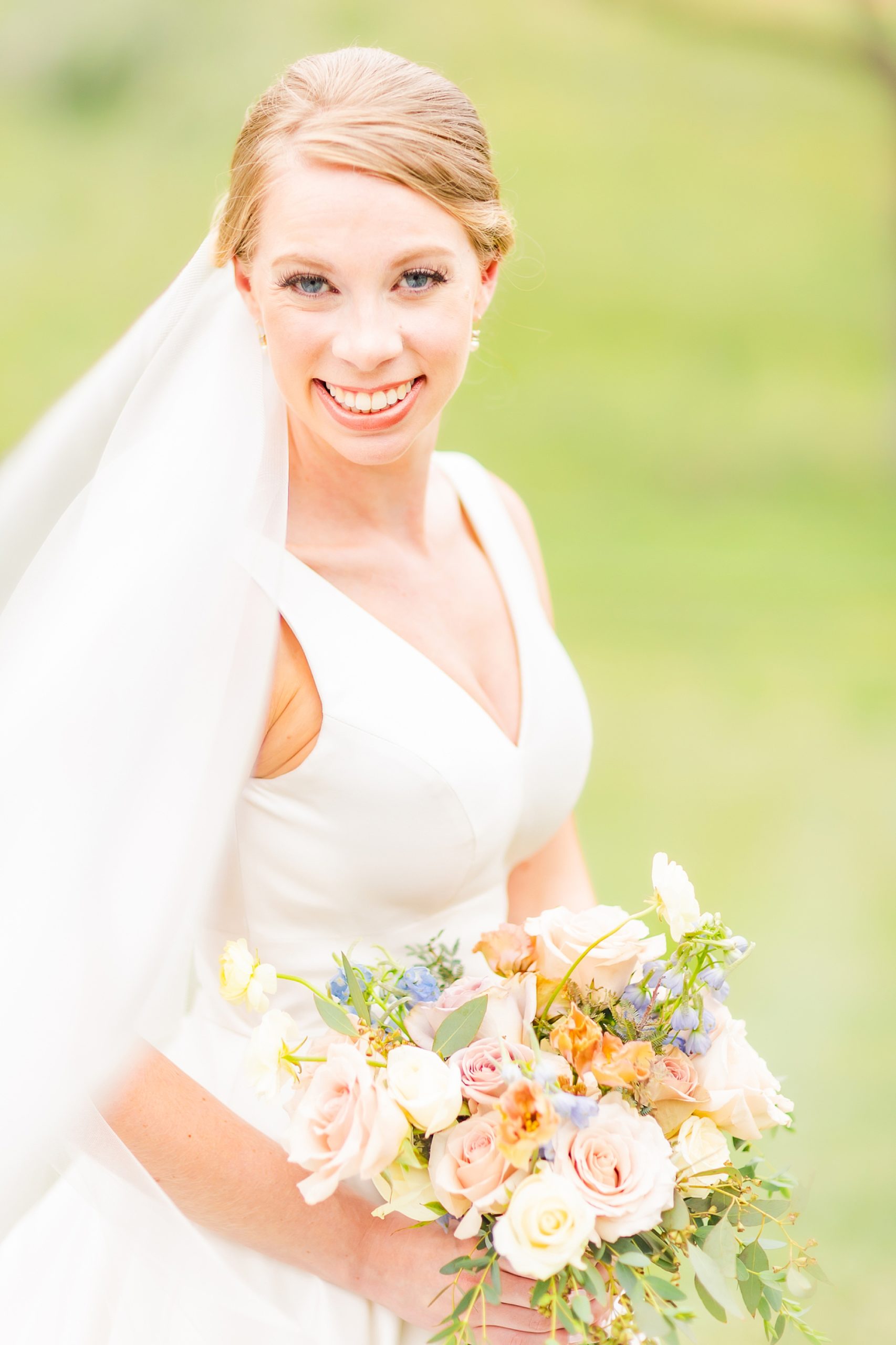bride smiles with veil behind her photographed by Charlotte wedding photographer Morgan Amanda Photography