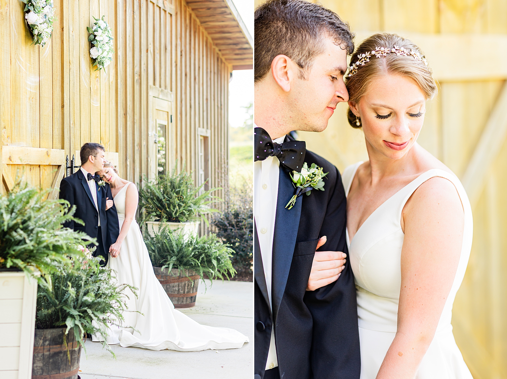 groom nuzzles bride's forehead standing outside barn door
