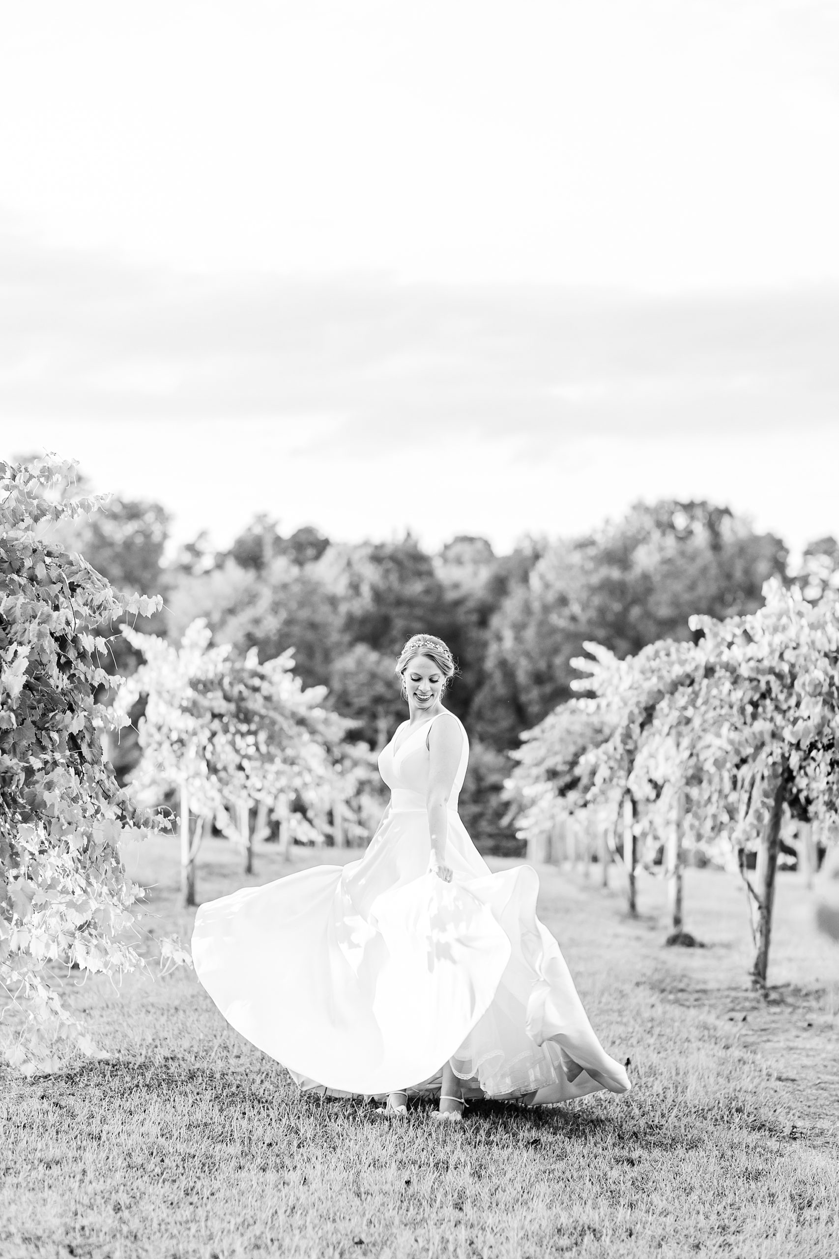 bride twirls in wedding dress at Old Homeplace Vineyard