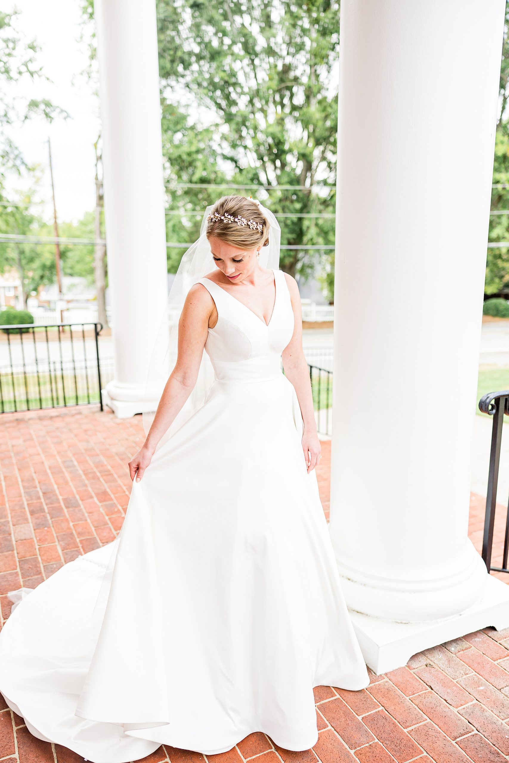 bride stands on patio of College Park Baptist Church