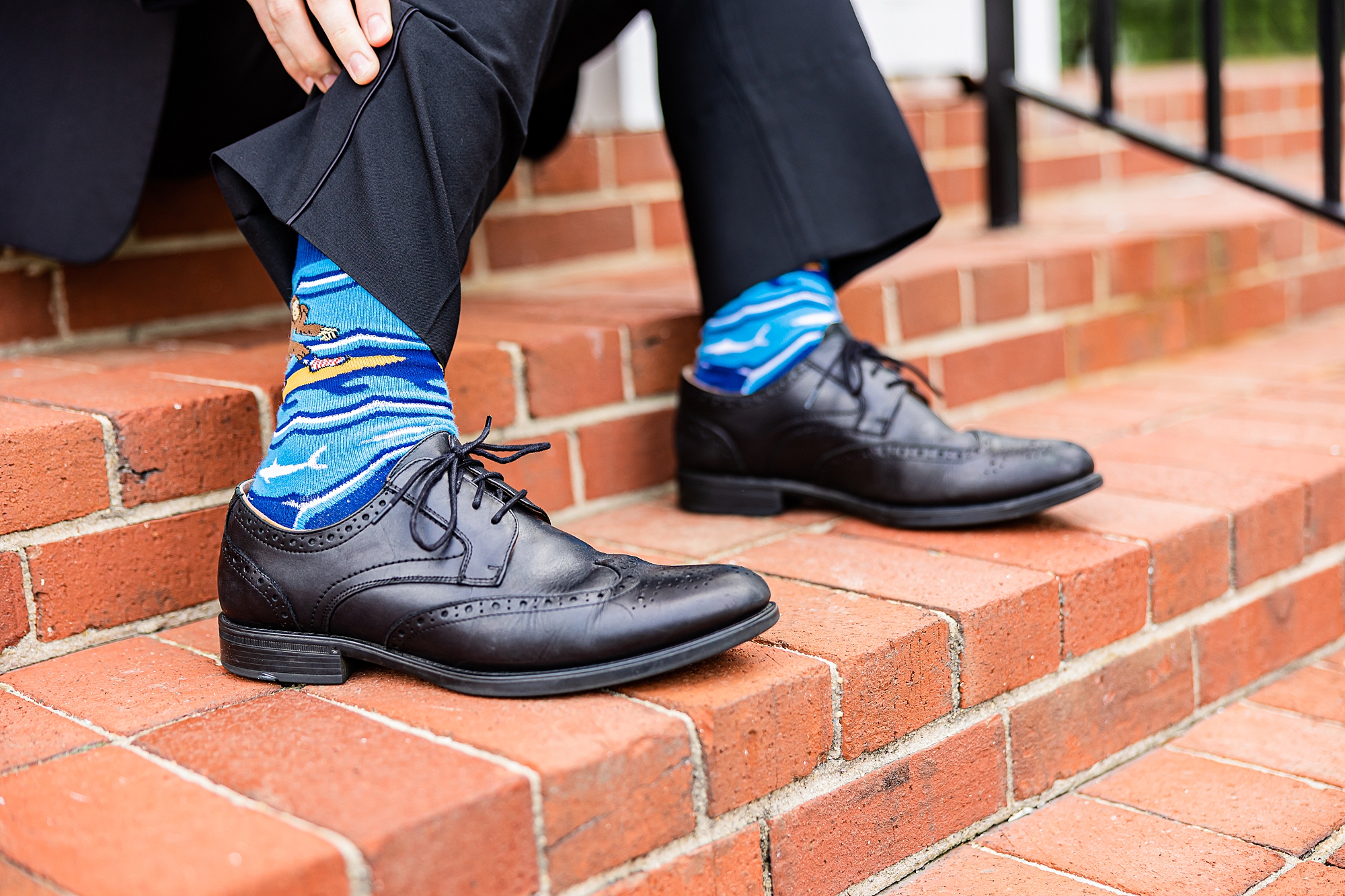 groom shows off colorful socks at College Park Baptist Church