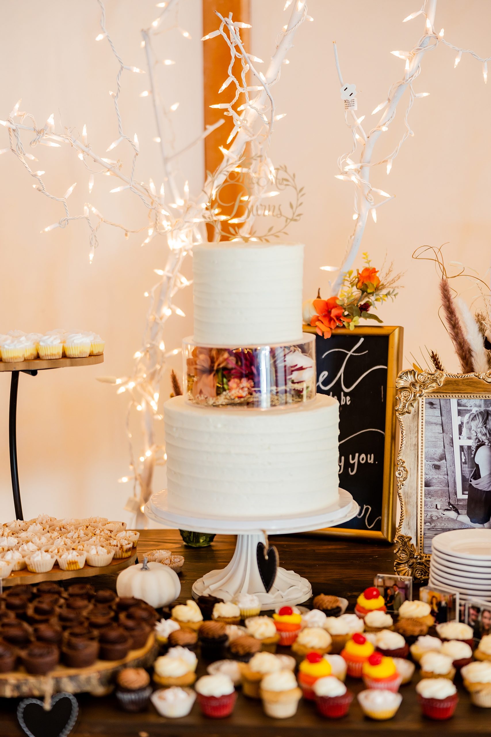 tiered wedding cake with gold topper for fall wedding reception at Camelot Meadows