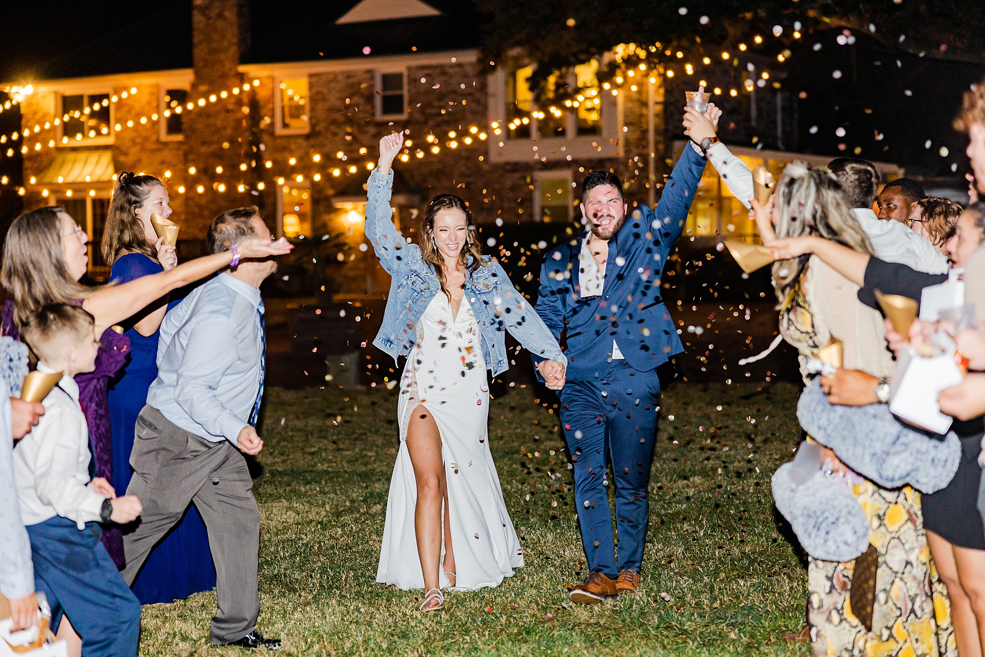 couple cheers during confetti exit from SC wedding reception
