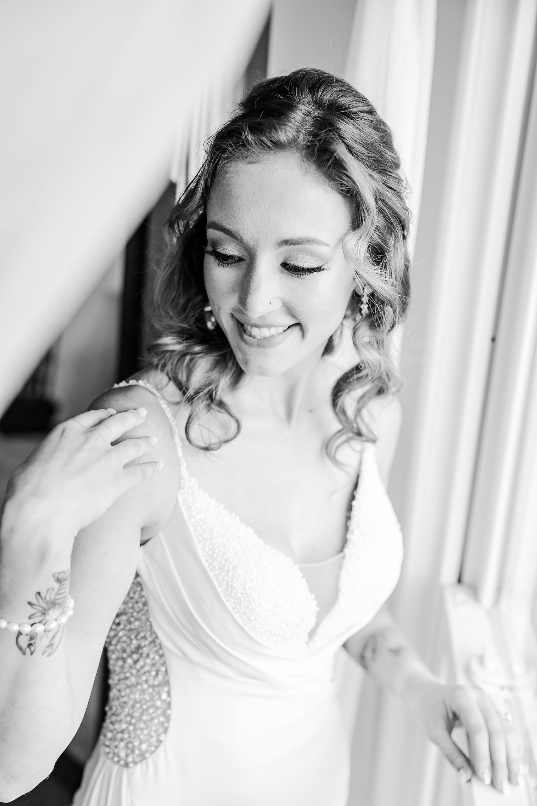 back and white portrait of bride preparing for Charleston wedding at Island House
