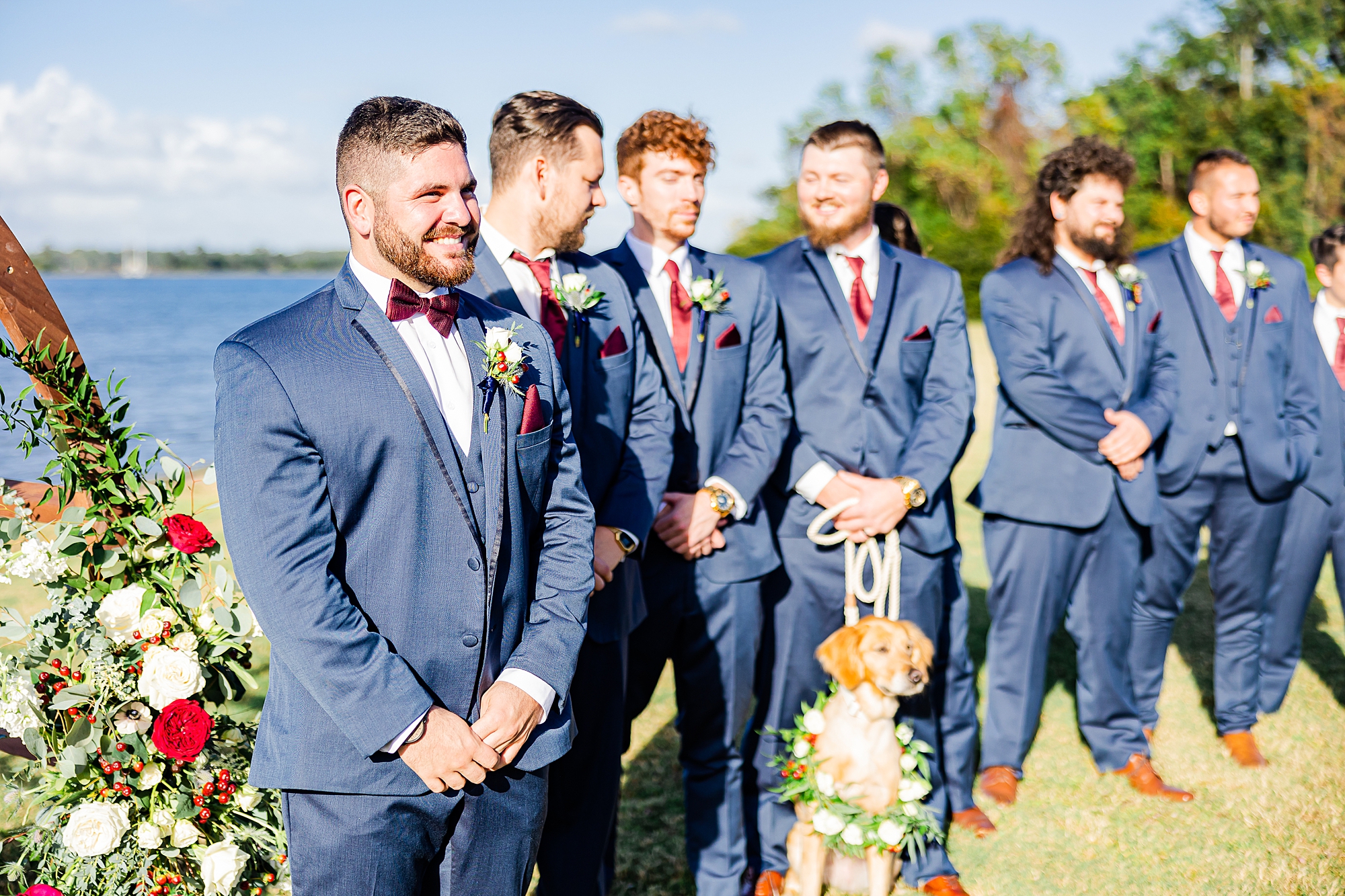 groom smiles watching bride walk down aisle for Charleston wedding ceremony 
