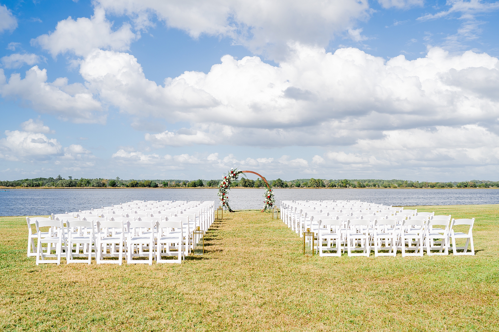 Charleston wedding ceremony site with white chairs and circle arbor 