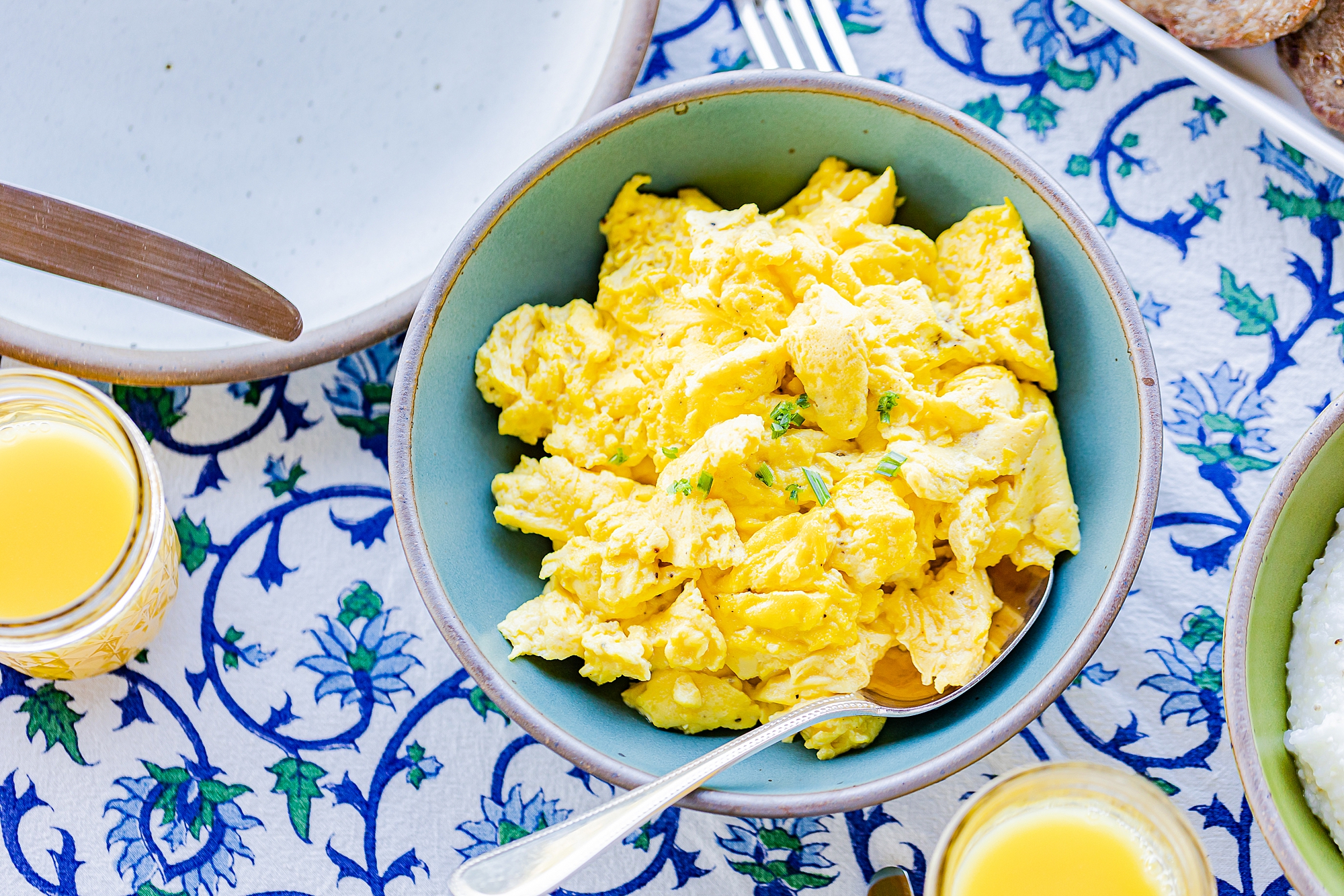 scrambled eggs in blue bowl for North Corner Haven product photos