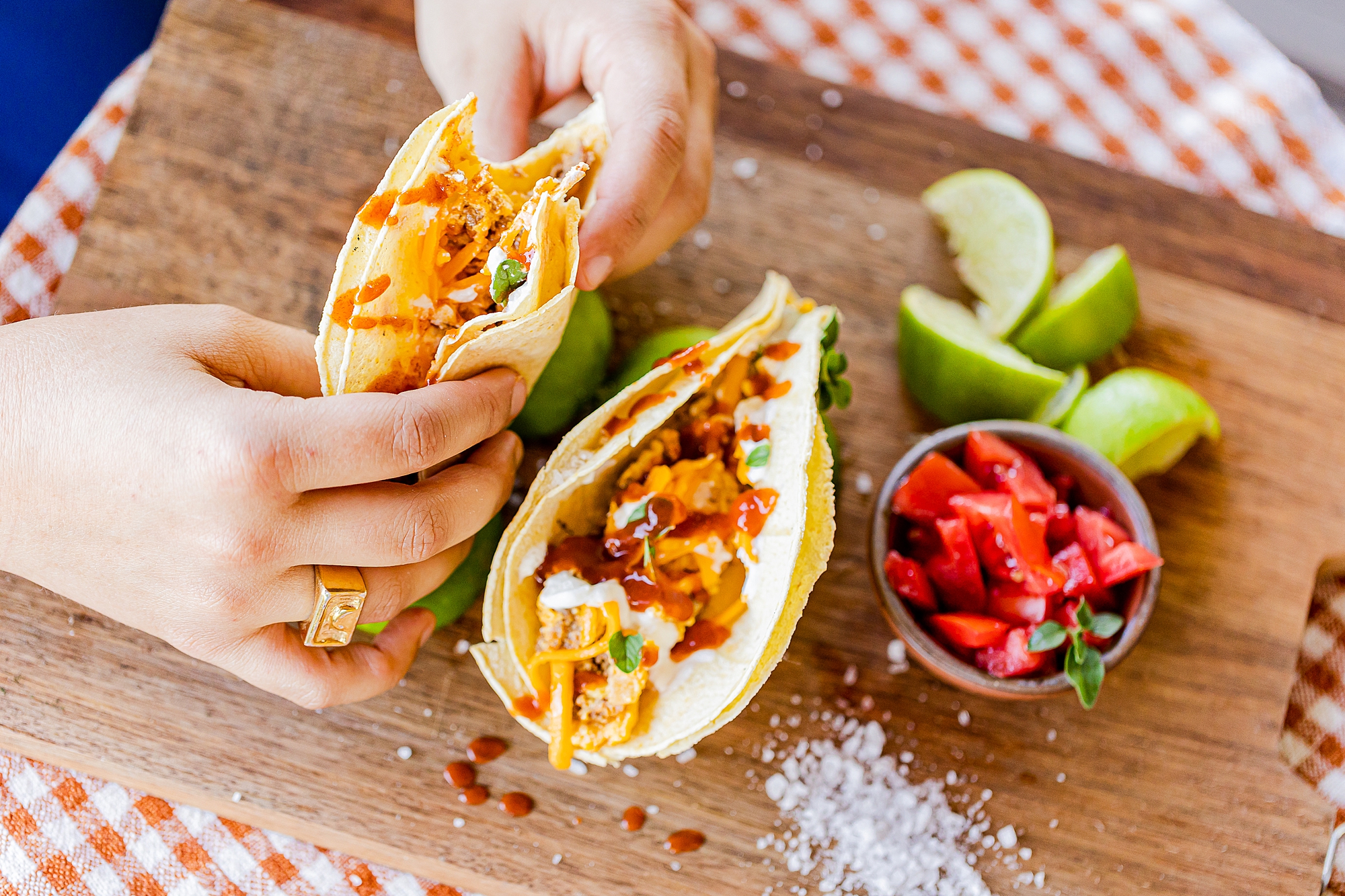 woman picks up tacos during North Corner Haven product photos