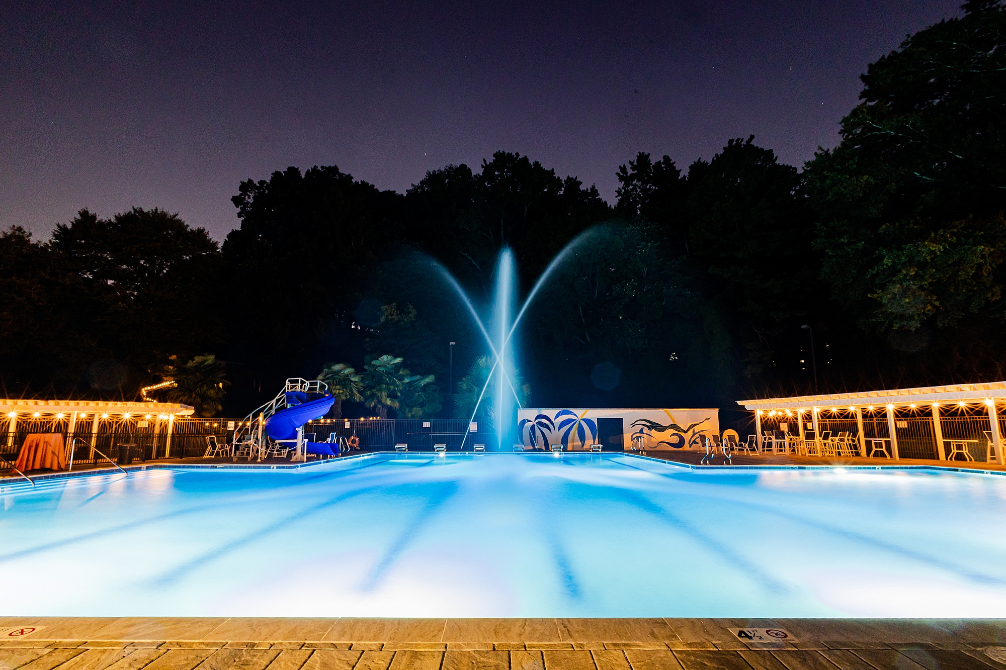 nighttime photo of pool at Starclaire Recreation Club