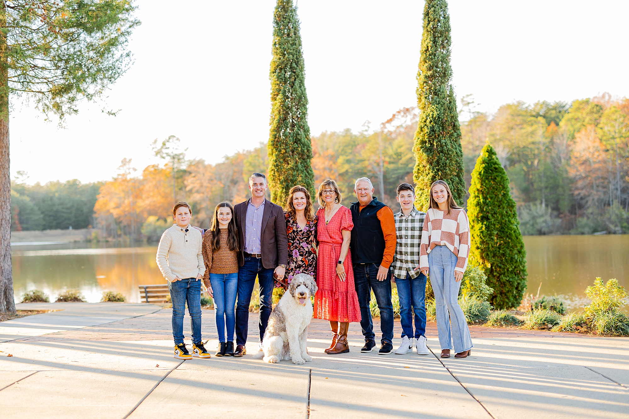 extended family poses in front of lake at Francis Beatty Park