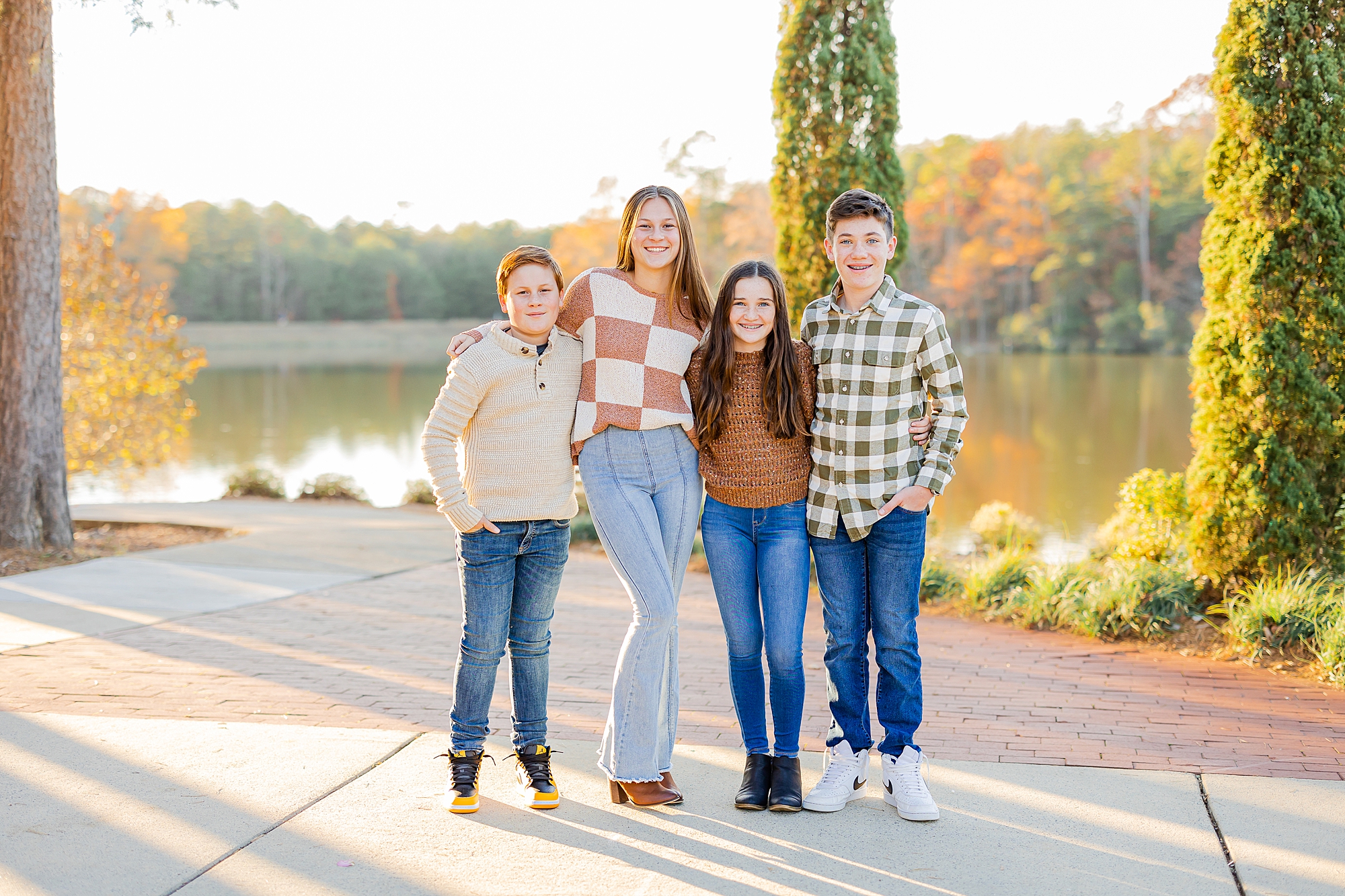 four children hug along lake during Francis Beatty Park family portraits 