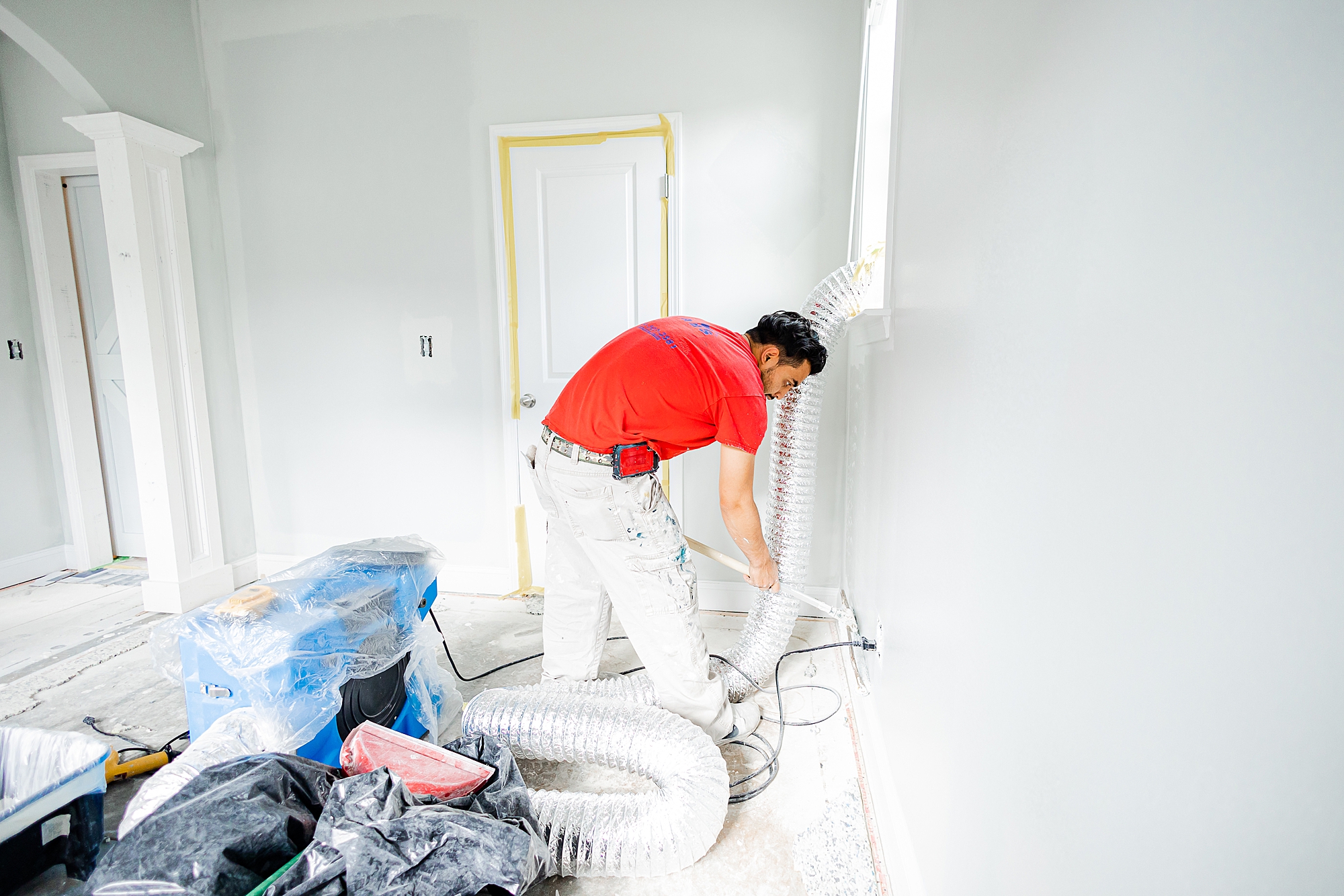 contractor works on walls during renovations with Turn Key Solutions