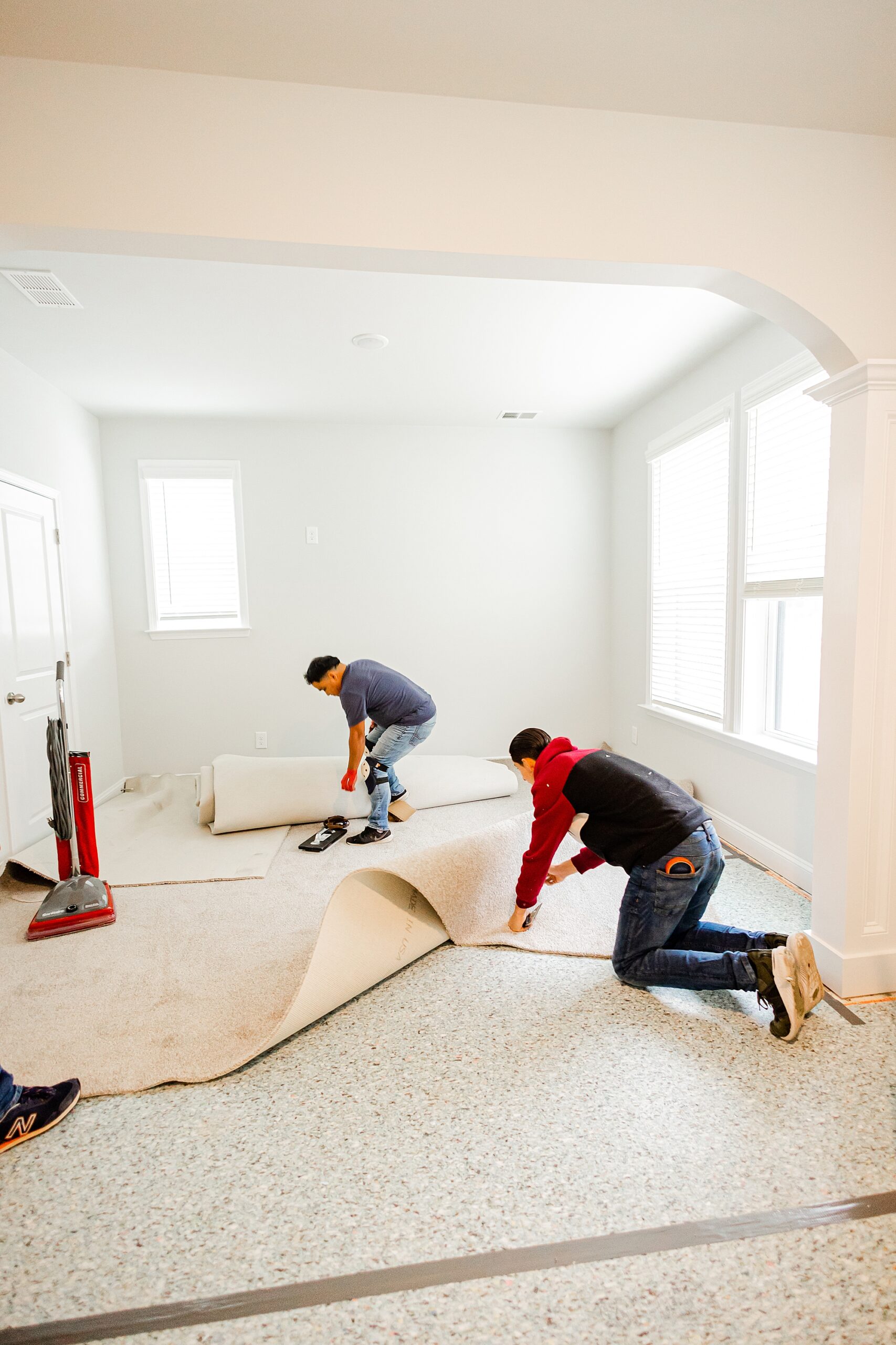 contractors put in carpet for renovations with Turn Key Solutions